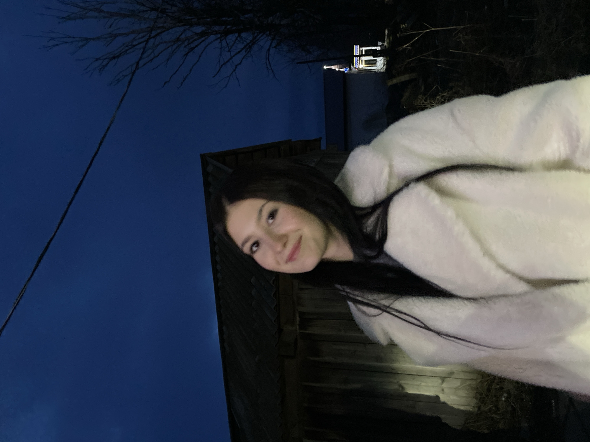 Woman poses for evening photos in white coat, Фоки Russia