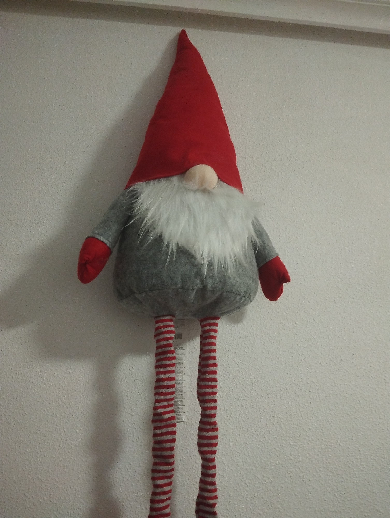 Decorative plush gnome spotted hanging on wall in Torrevieja