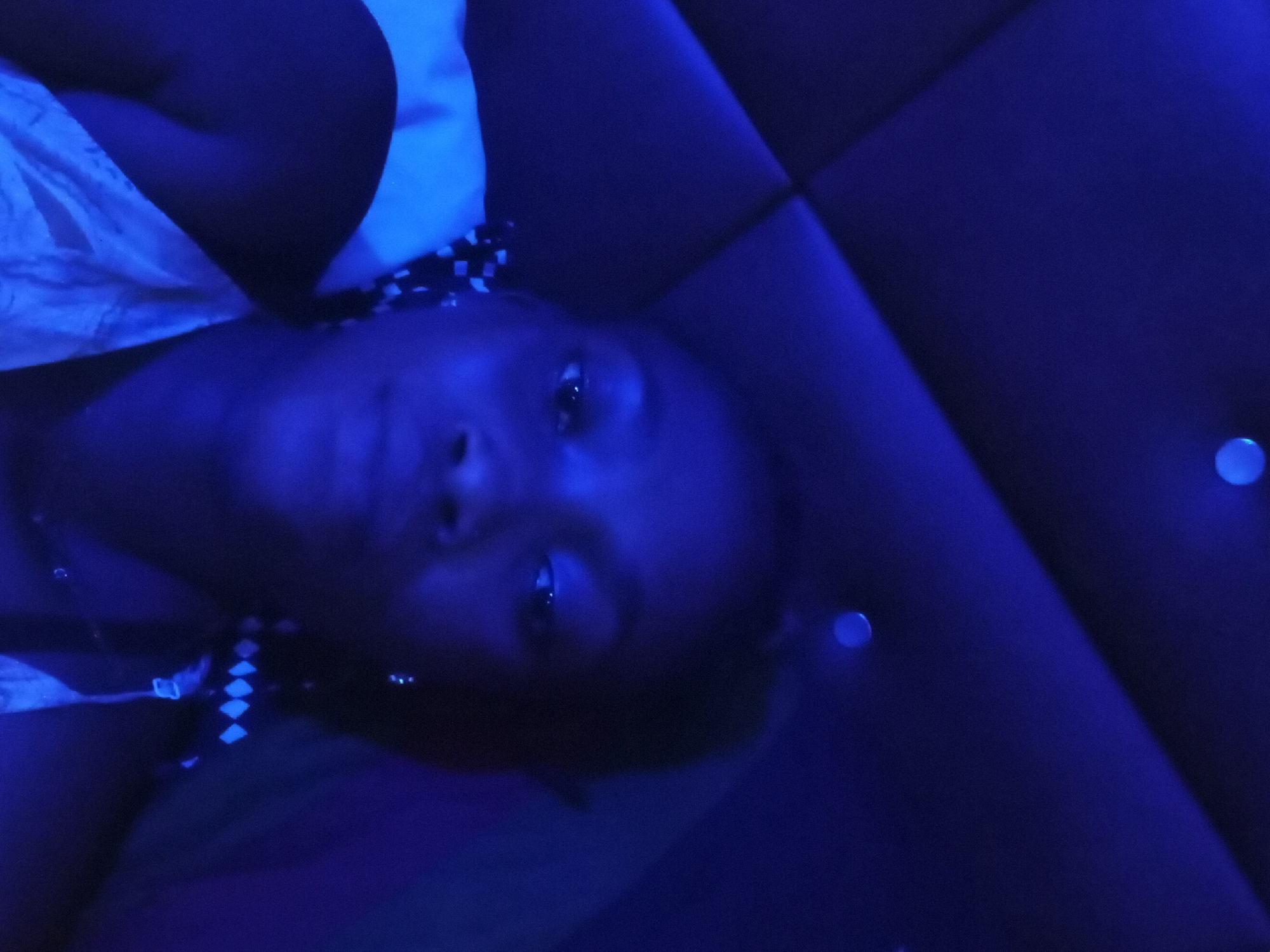 Blue-lit indoor portraits captured in Shagamu, Nigeria residence