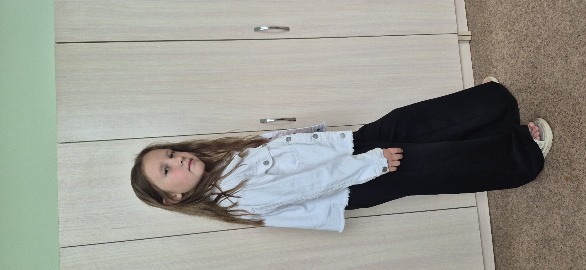 Girl in white jacket captured in indoor poses