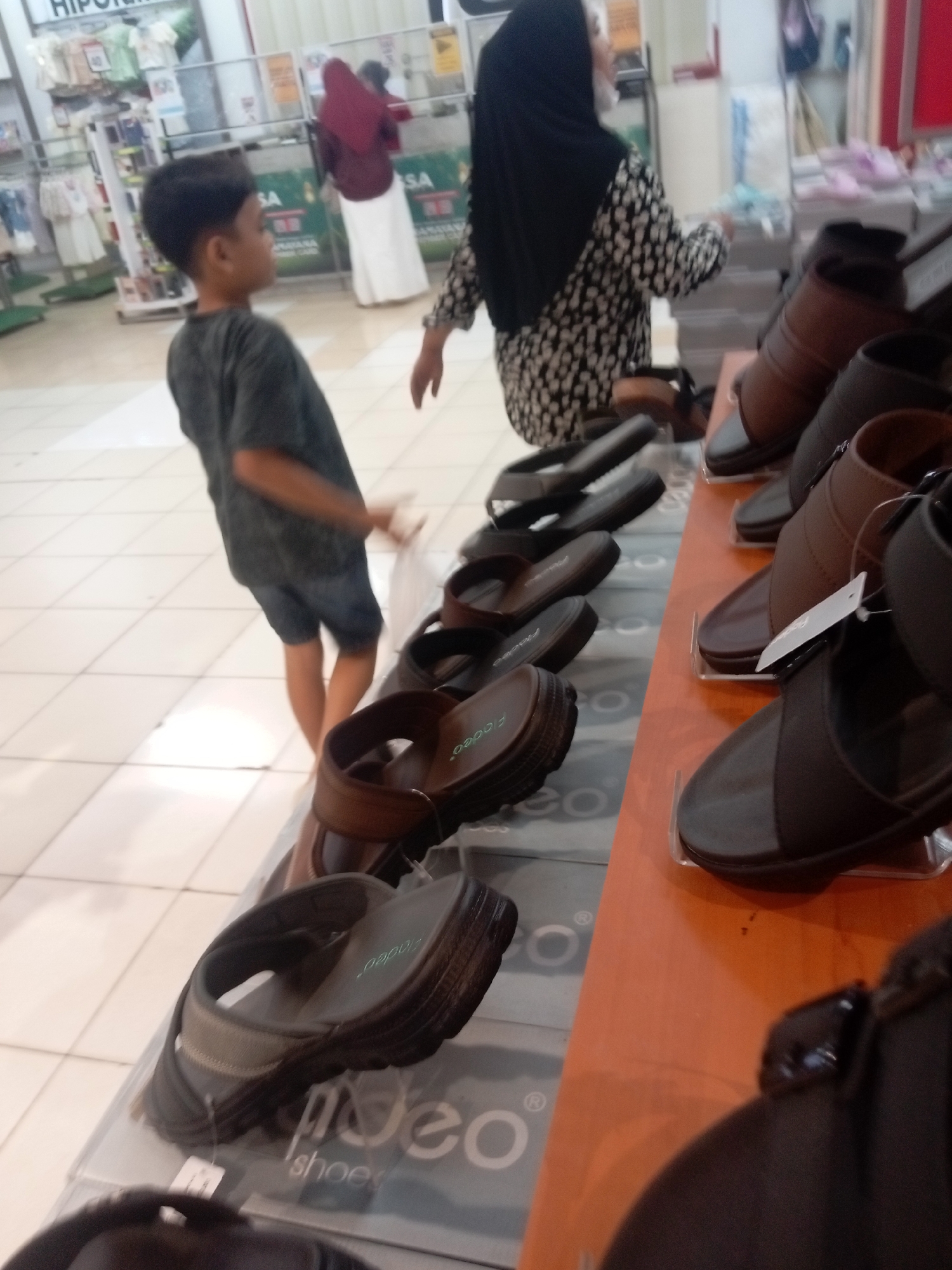 Browsing shoes and clothes at a Batam mall