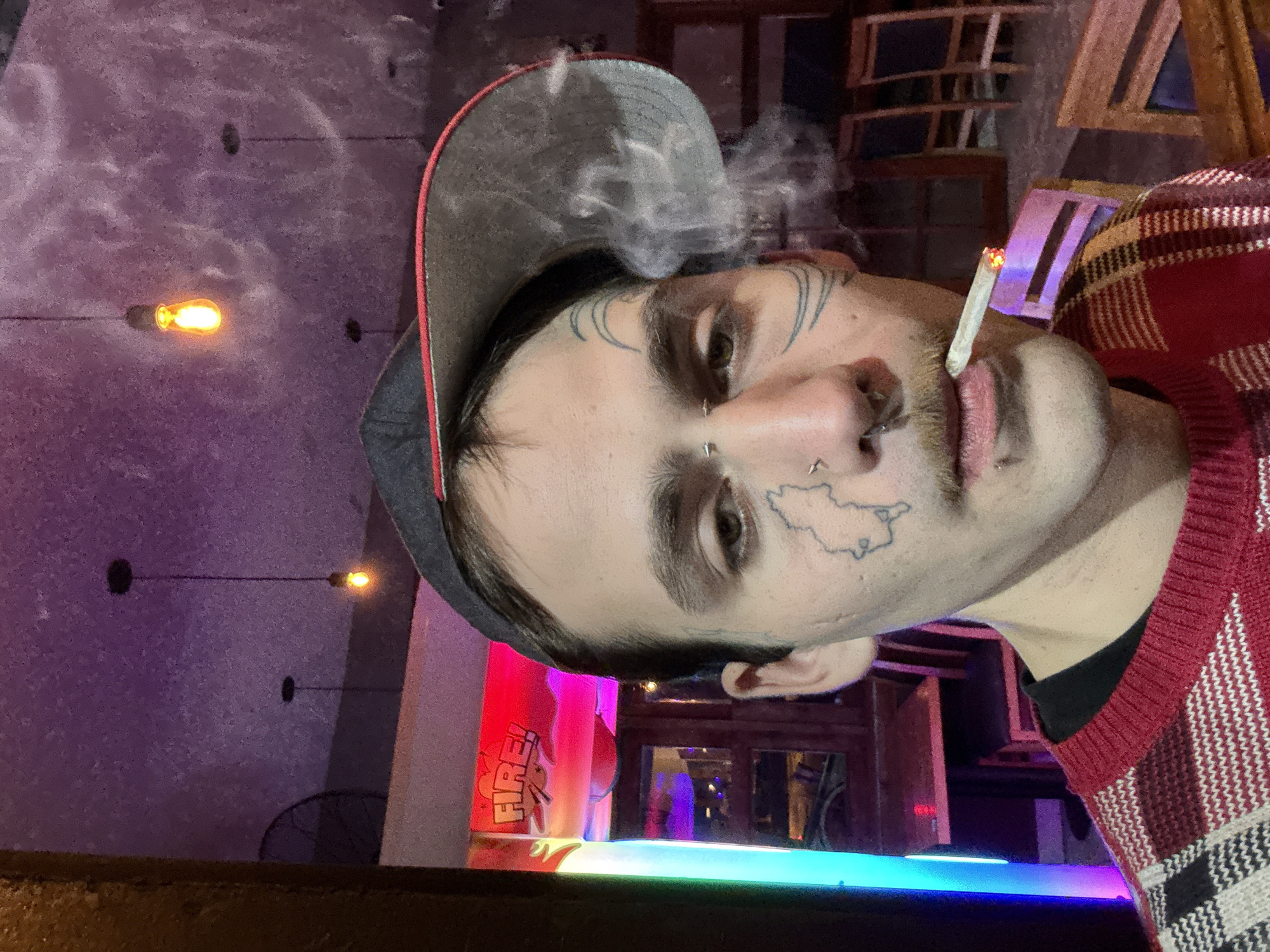 Man photographs himself smoking in Buenos Aires public restroom