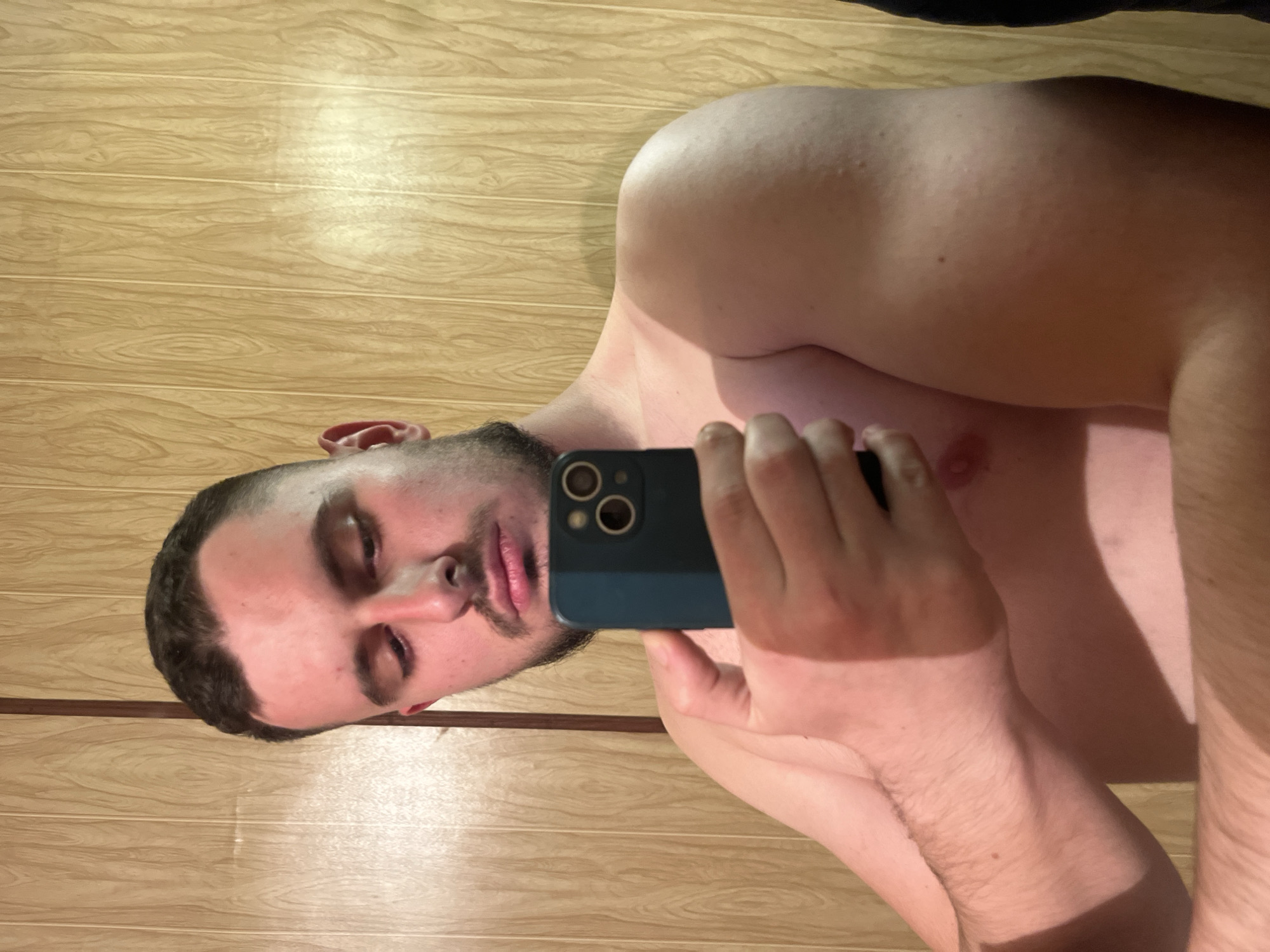 Man takes selfie against wooden wall in Burgas