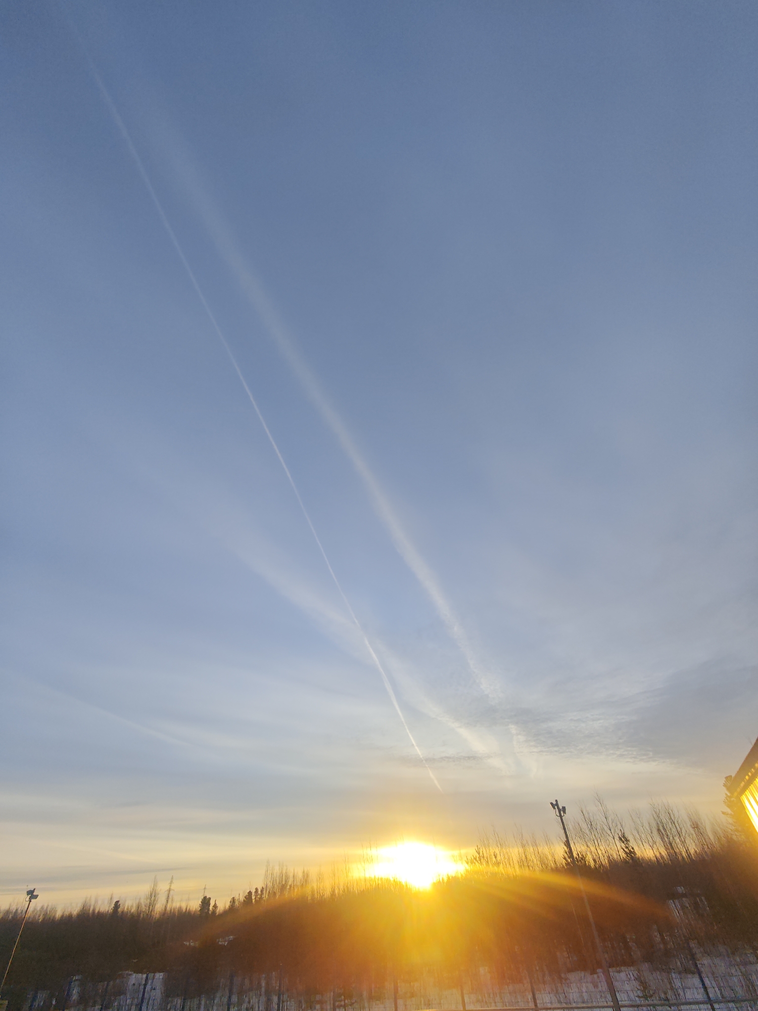 Russian industrial worker documents dawn shift in winter landscape