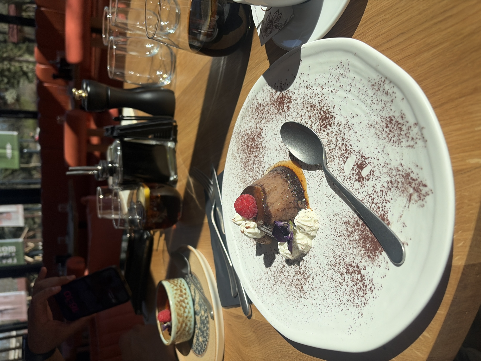 Garnished cake slice served at Sofia café