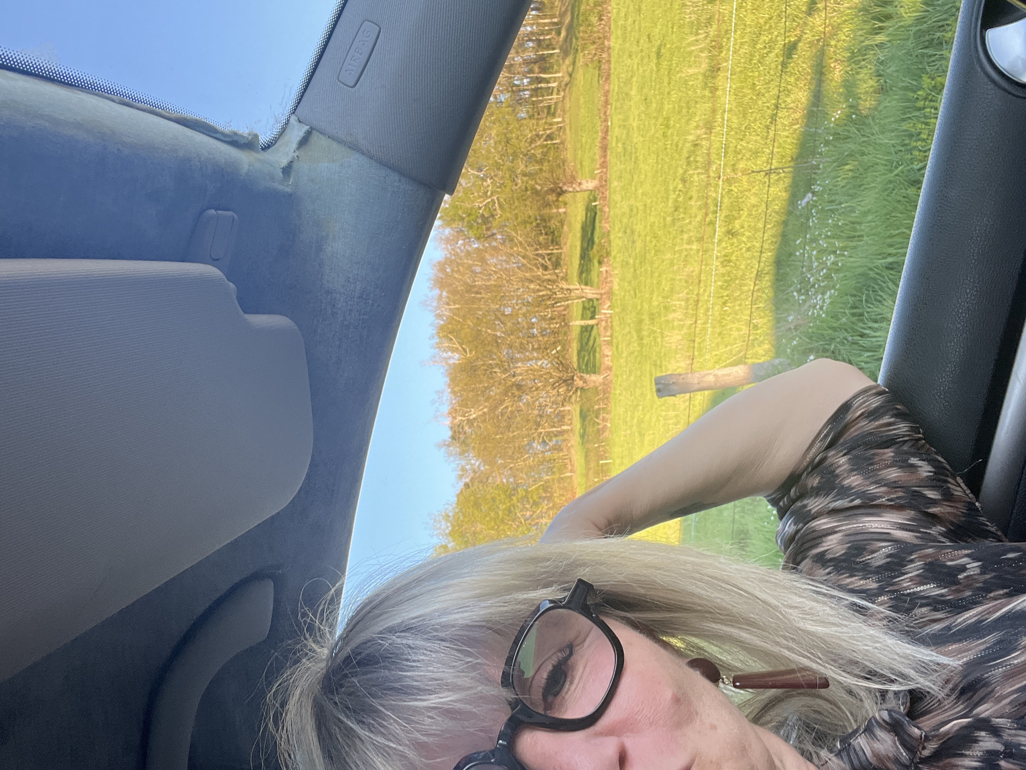 Woman takes selfies during skincare routine in French village
