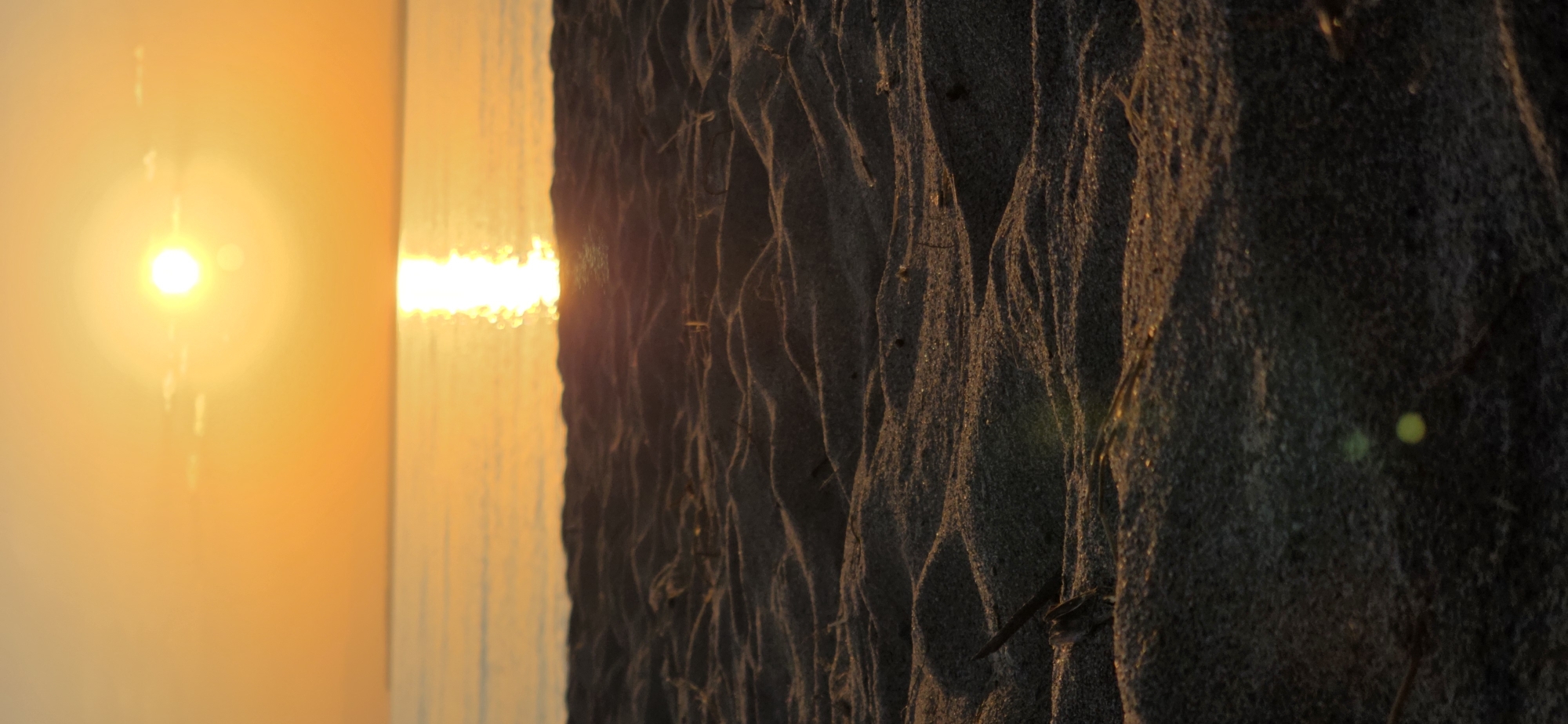 Golden sunset over sand and water in rural Kyrgyzstan