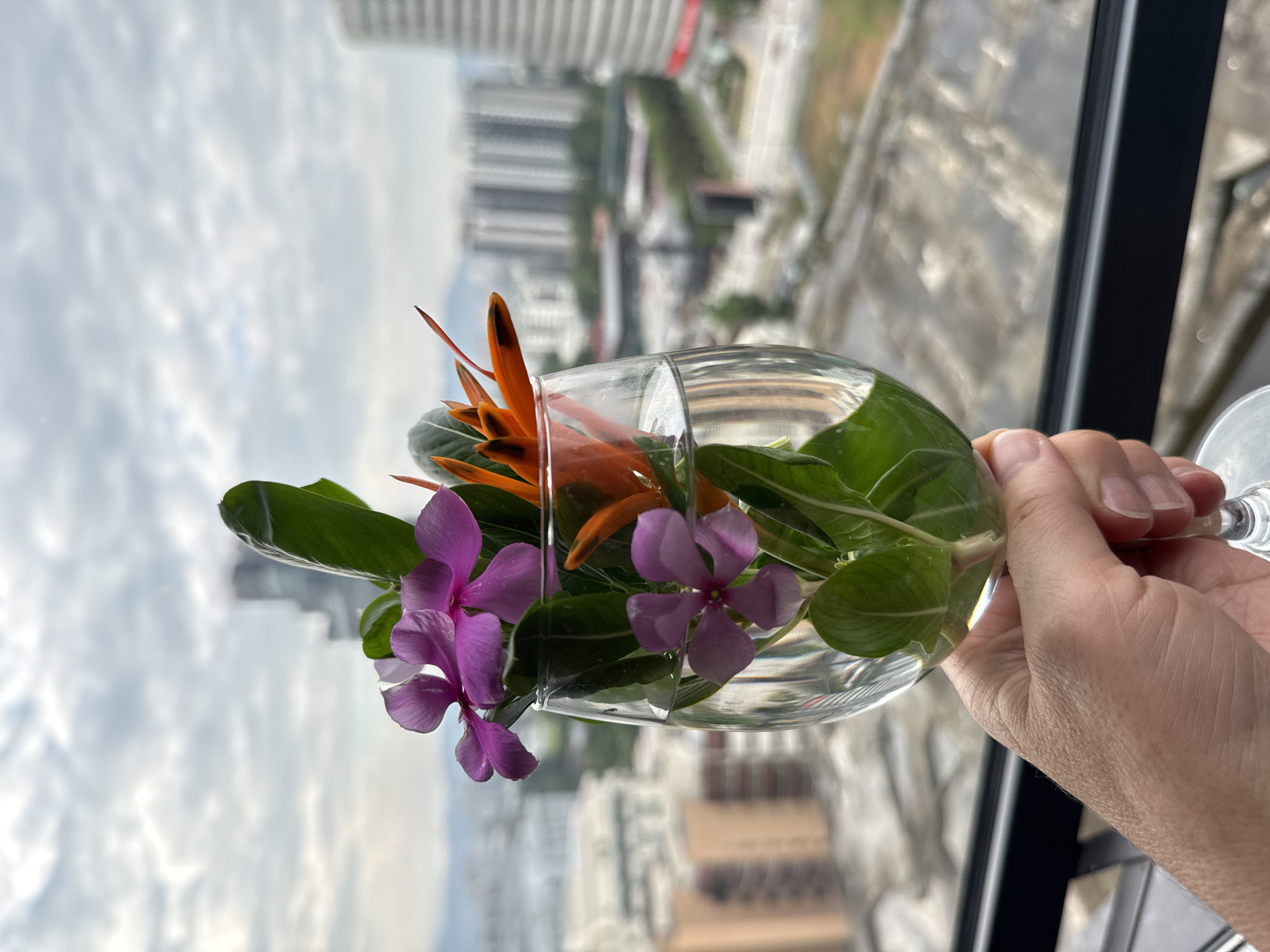 Flowers held against the Kuala Lumpur skyline