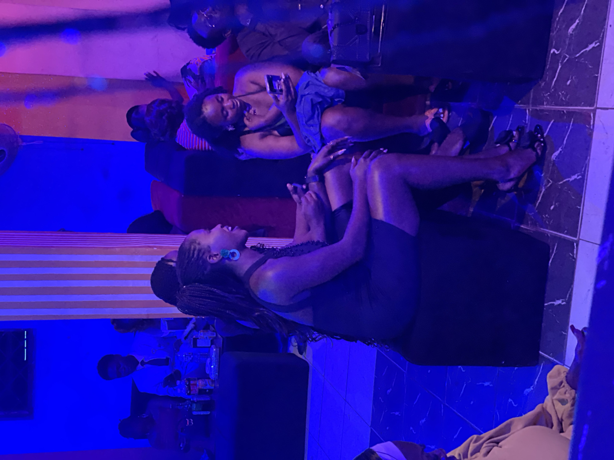 Night out at a neon-lit lounge in Durumi, Nigeria
