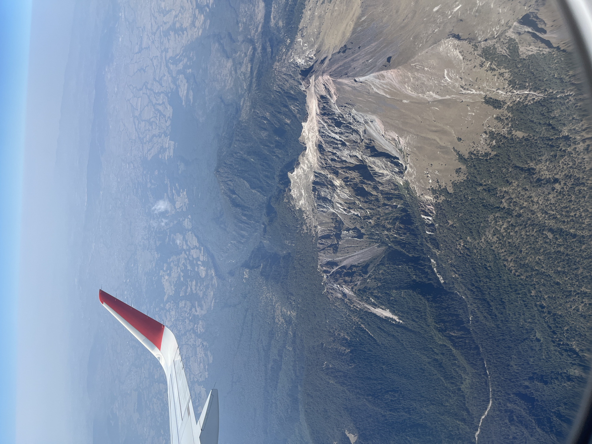 Aerial view captured of Mexican mountains from banking aircraft