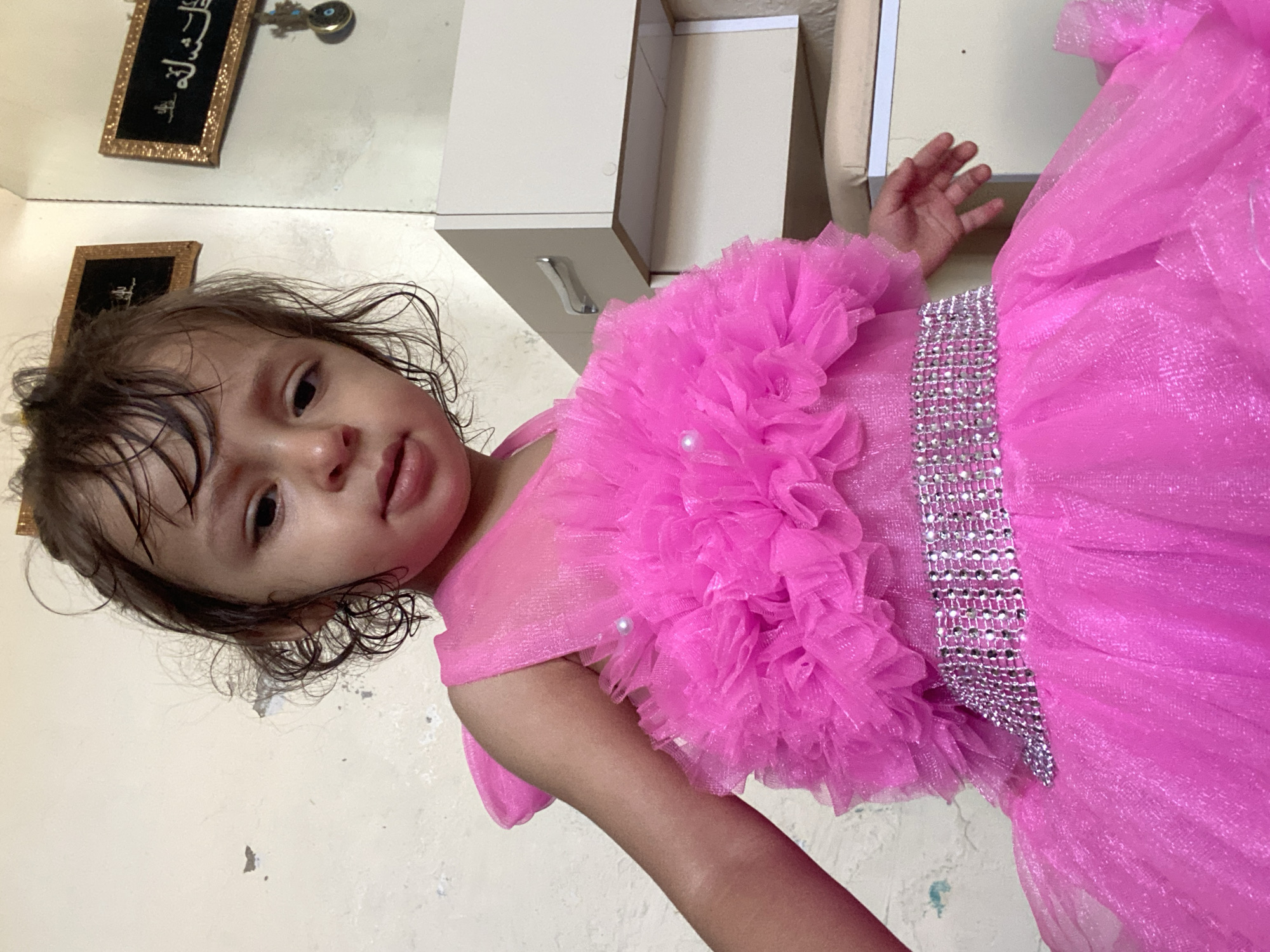 Toddler in pink dress photographed in Kandahar