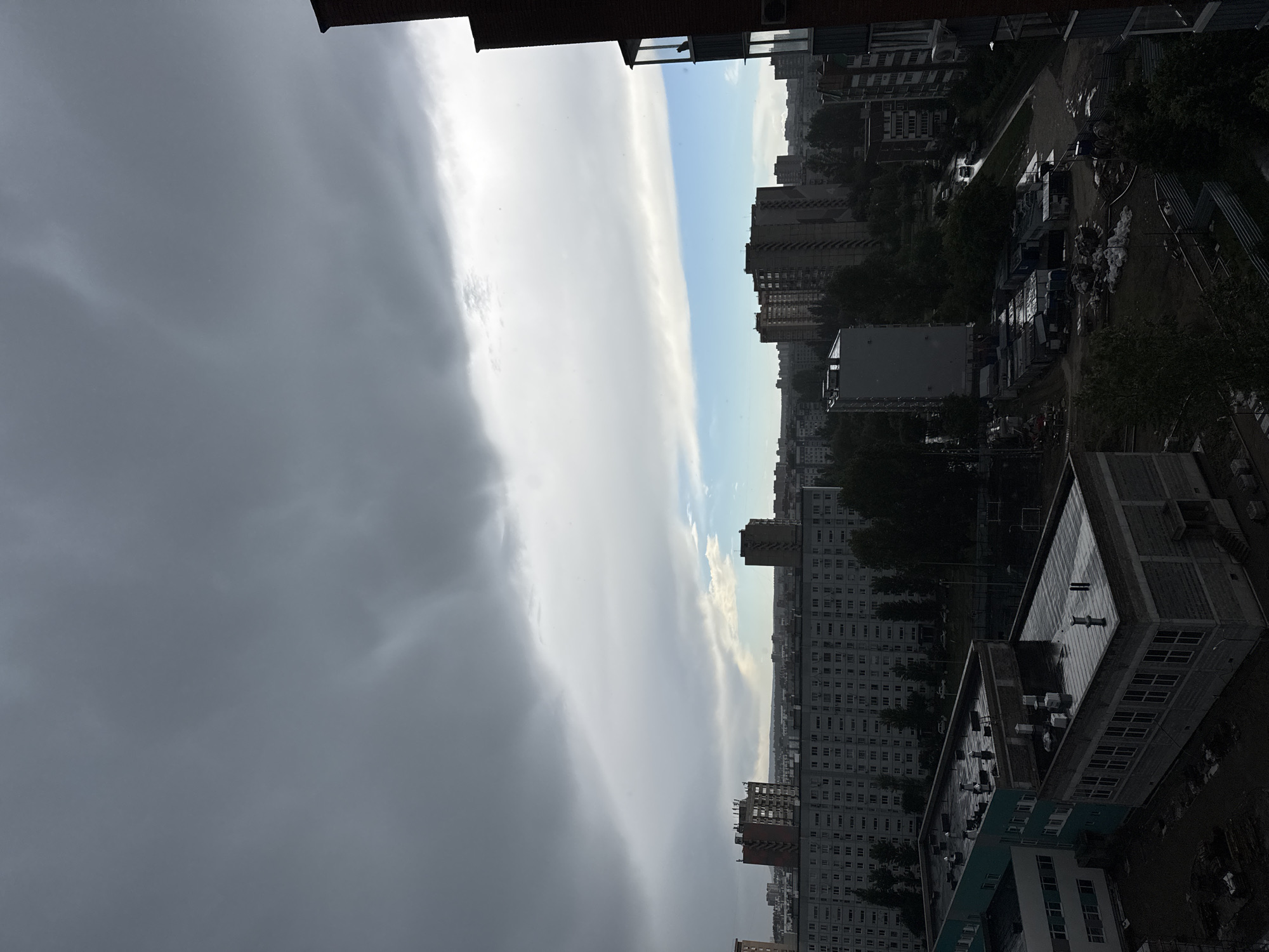 Urban rainstorm documented through car windows and personal moments