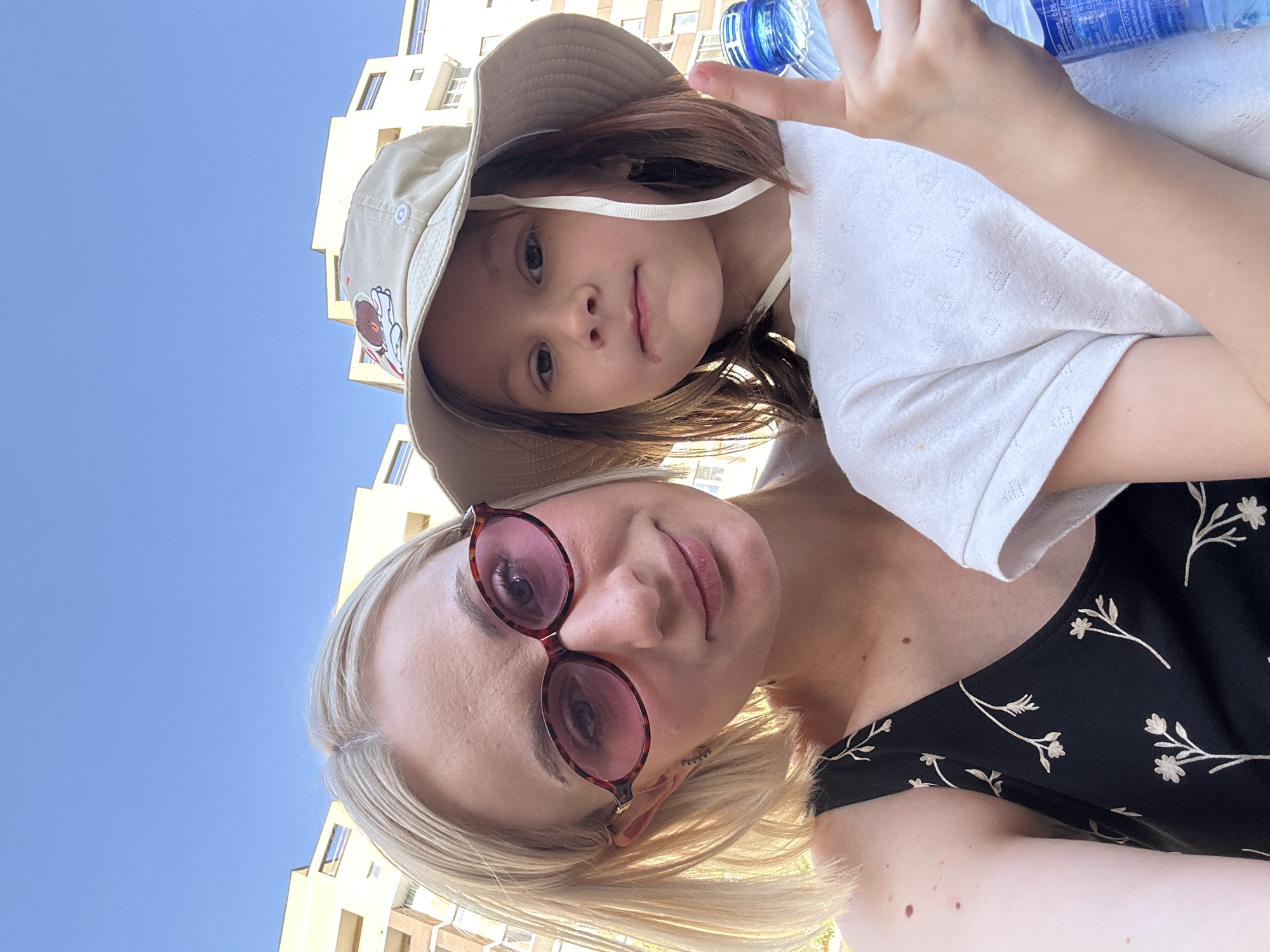 Woman and child take selfies in Pushkino park