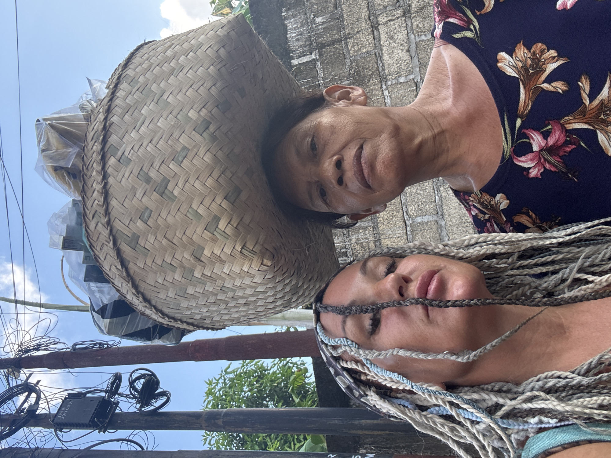 Street vendors and traditional architecture documented in Kuta