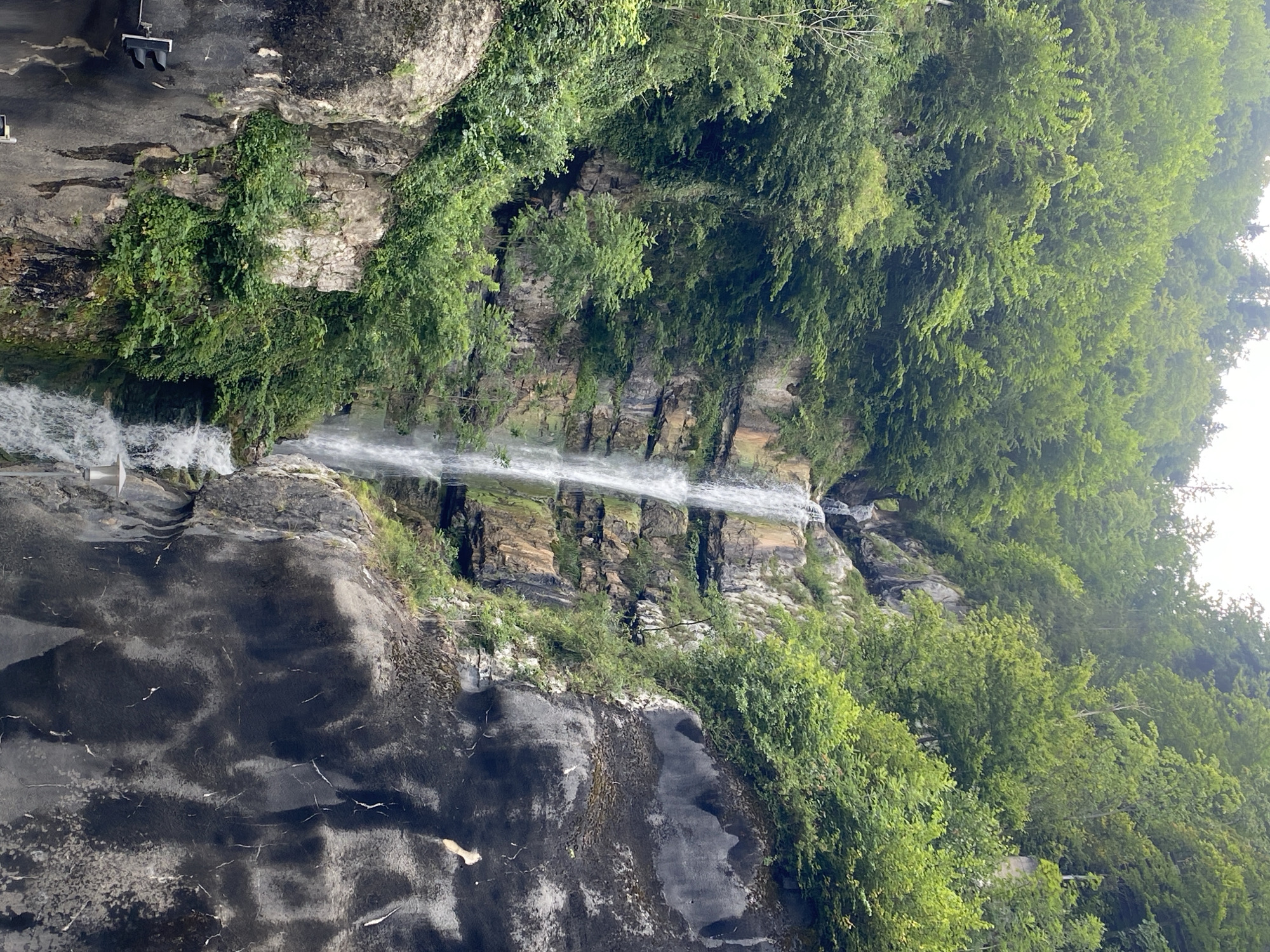 Hallstatt streets, rooftops, and waterfalls on a July afternoon