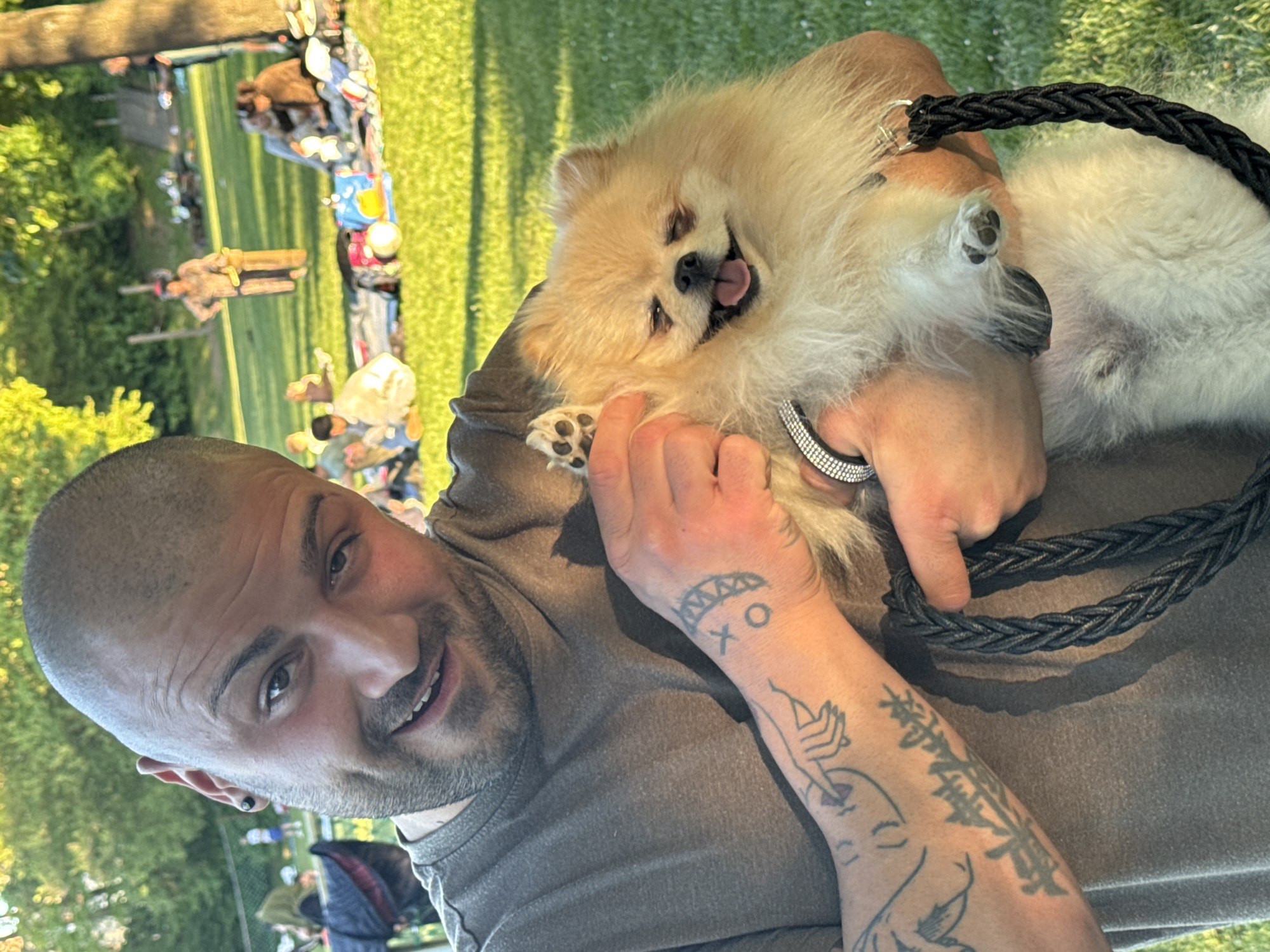 Man enjoys outdoor moment with fluffy Pomeranian in Ditzingen