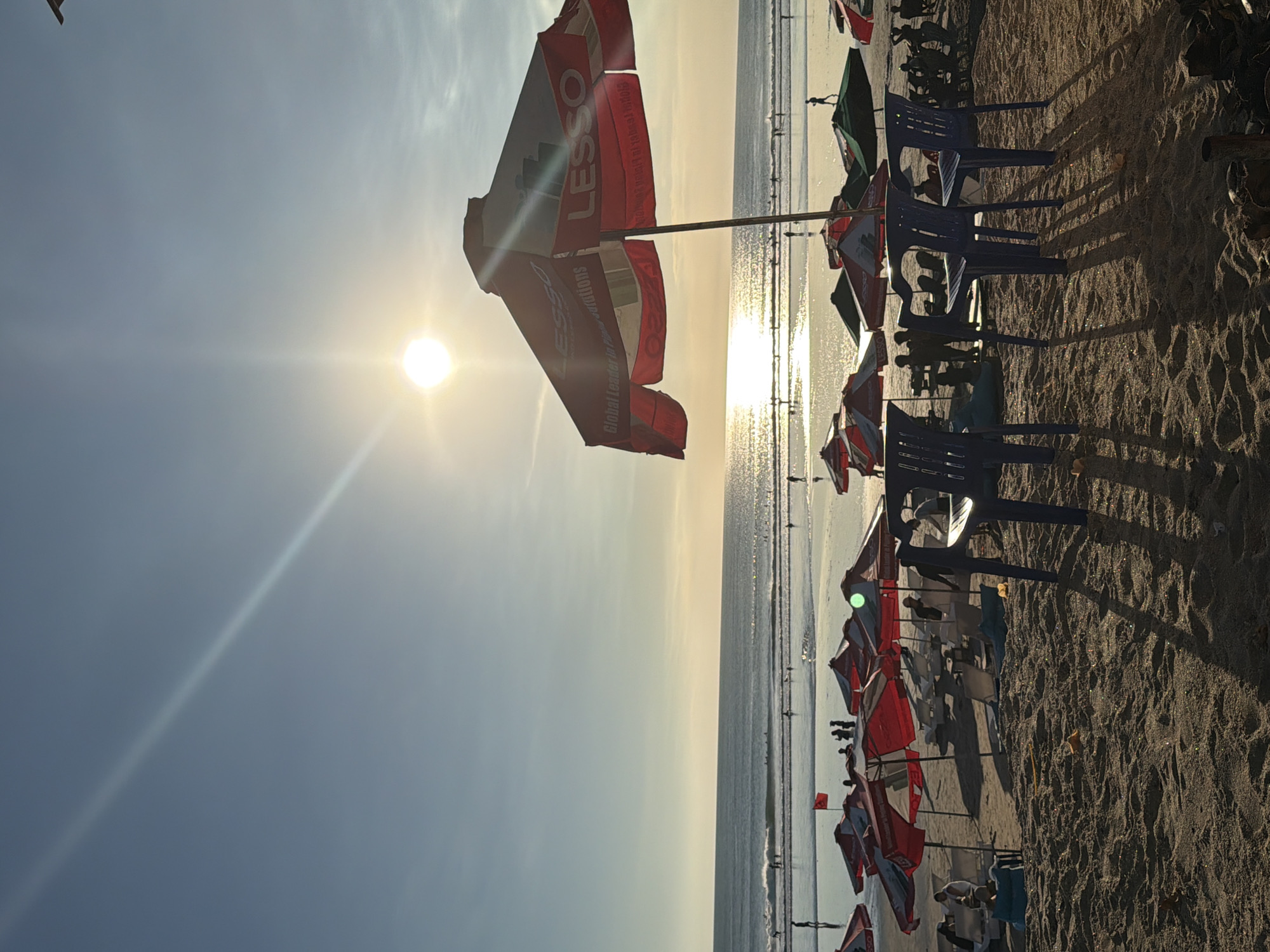 Kuta Beach at golden hour — surf, sand, and street life
