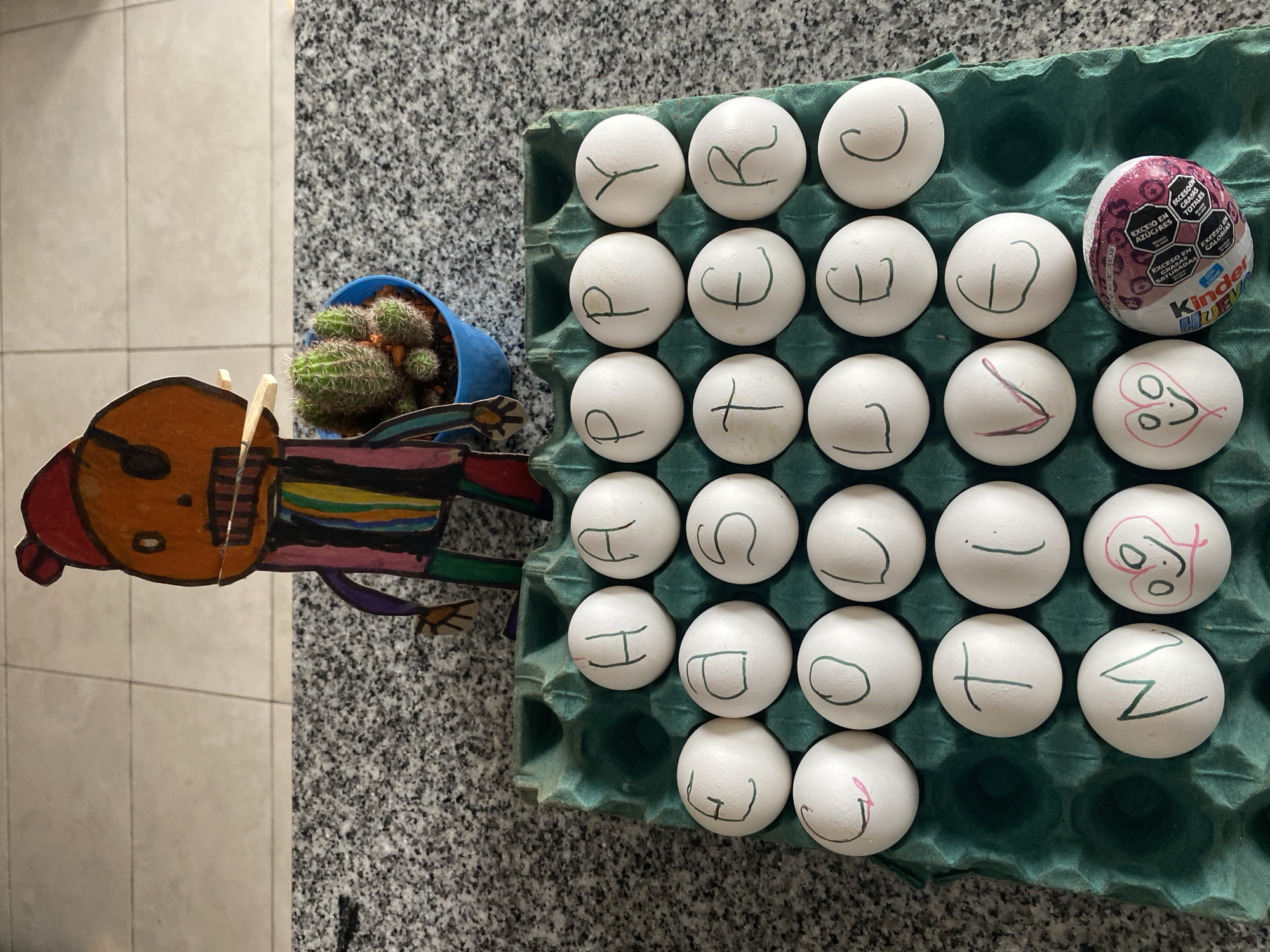 Letter-marked eggs displayed on kitchen counter in Wilde, Argentina