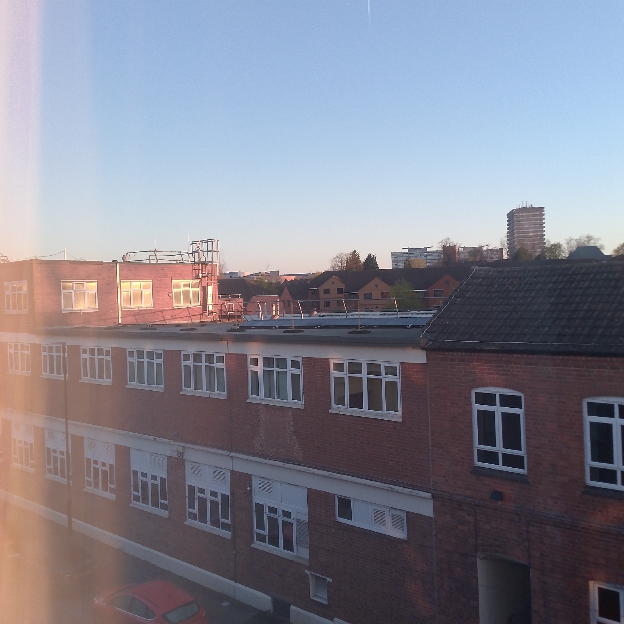 Solar-paneled brick building photographed in early morning Coventry