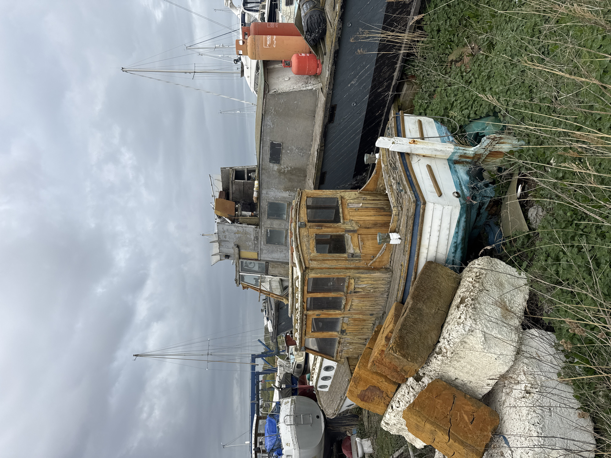 Derelict boat documented in East Suffolk coastal storage area