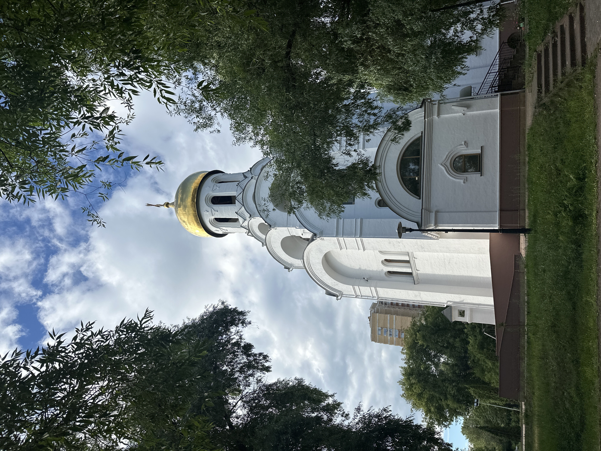Sunny afternoon around Kotelniki's park, pond, and church