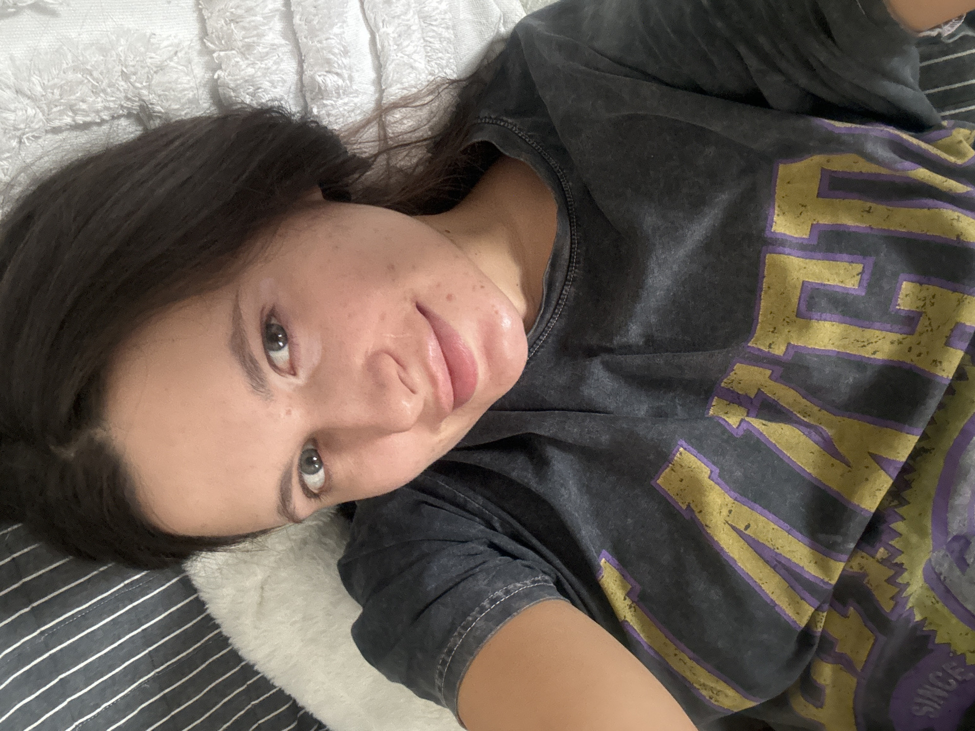 Woman resting on bed observed in Akulovo, Russia