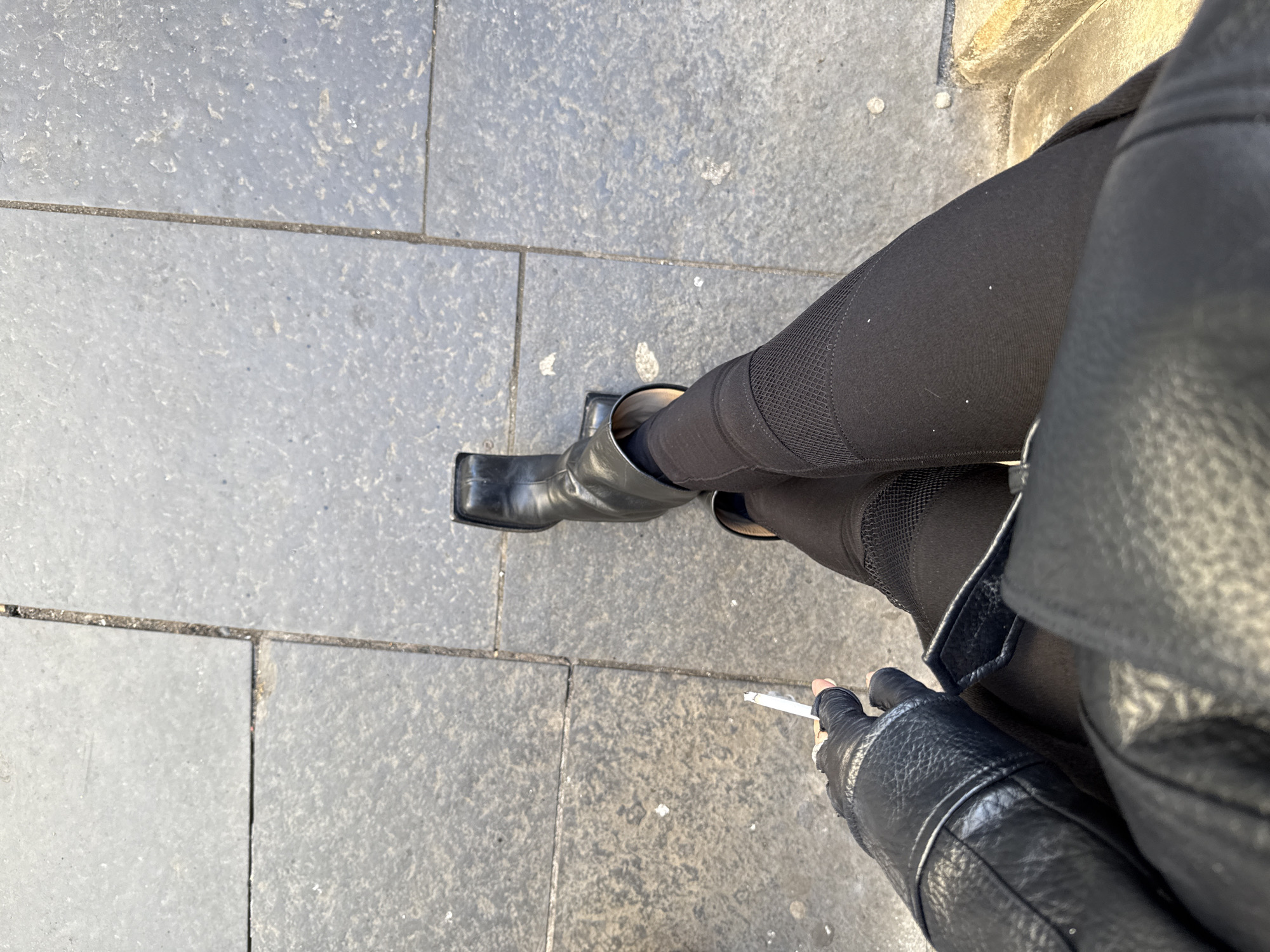 Person in black attire observed on Edinburgh sidewalk