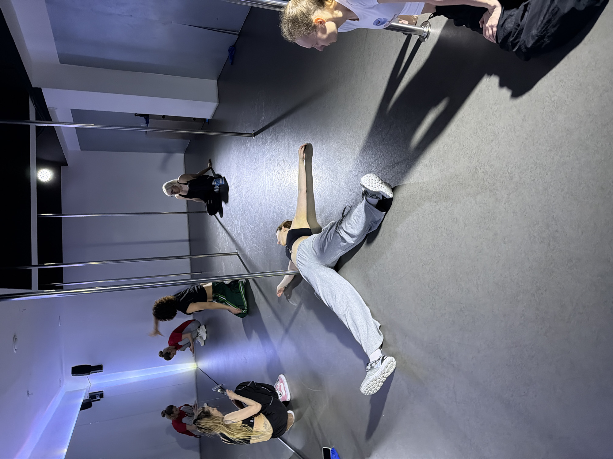 Women attend pole fitness classes at Moscow studios