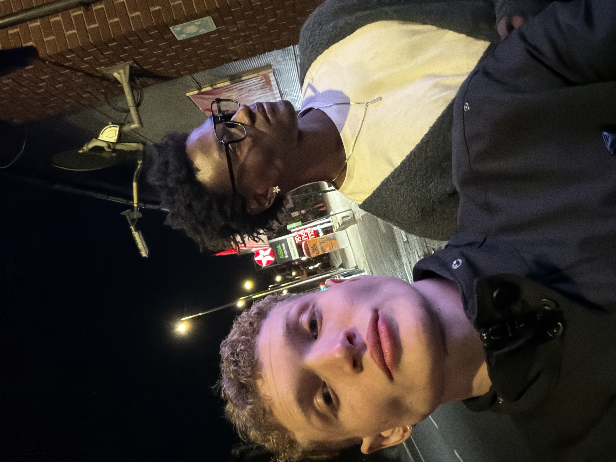Selfie taken at London Texaco station with luxury cars