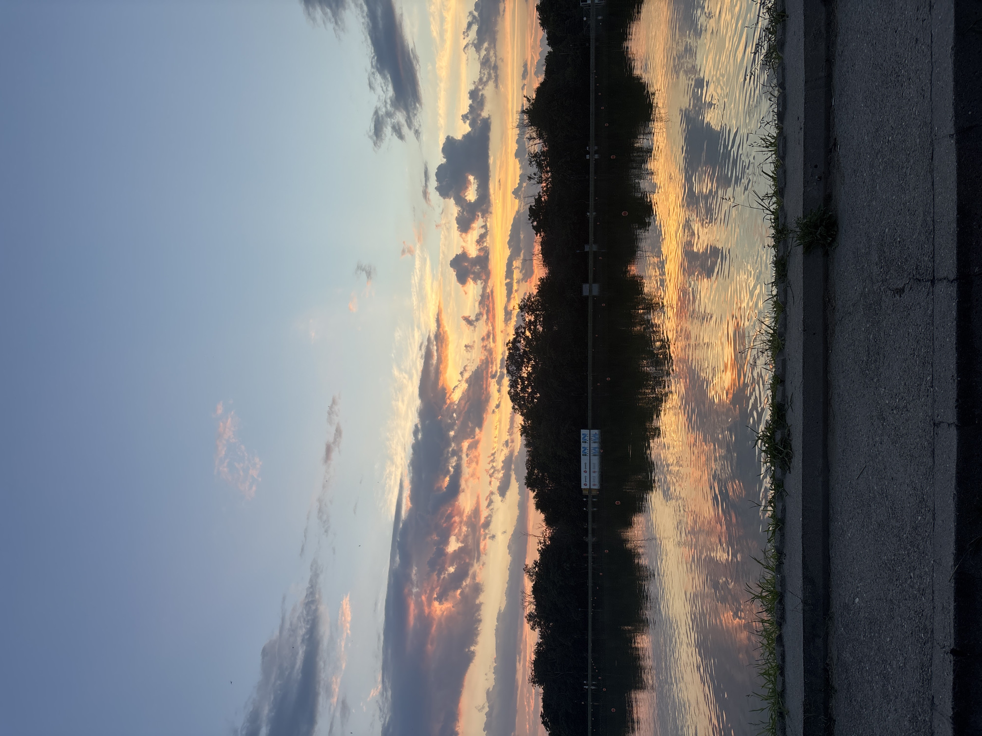 Sunset at Plovdiv's rowing canal alongside city construction views