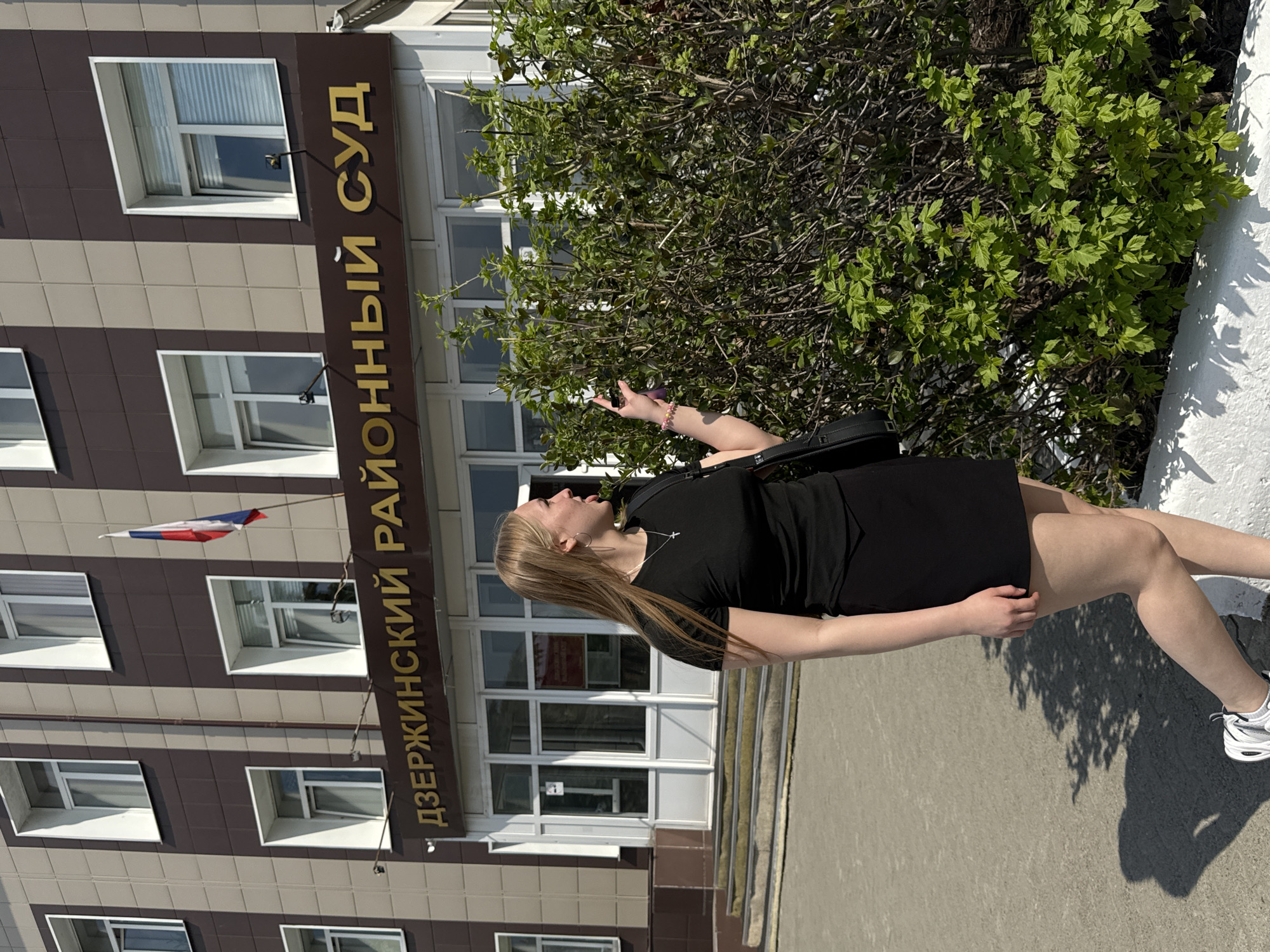 Woman photographed outside district court building in Perm, Russia