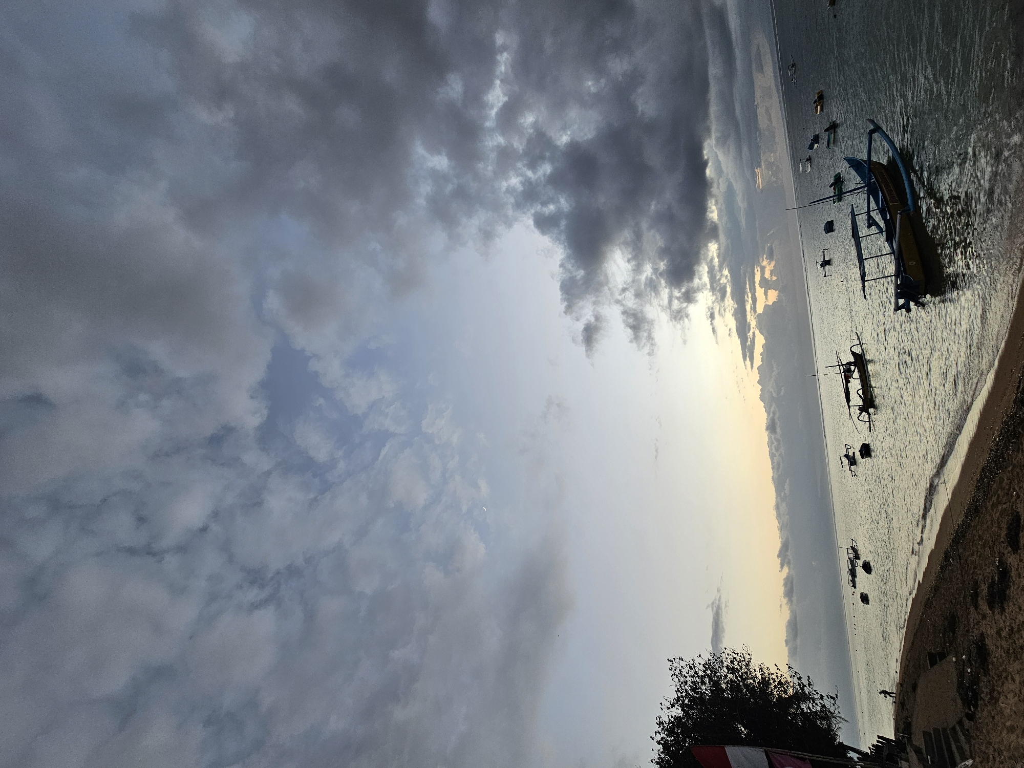 Overcast morning at Sanur Beach — boats, shoreline, quiet coastal scenes