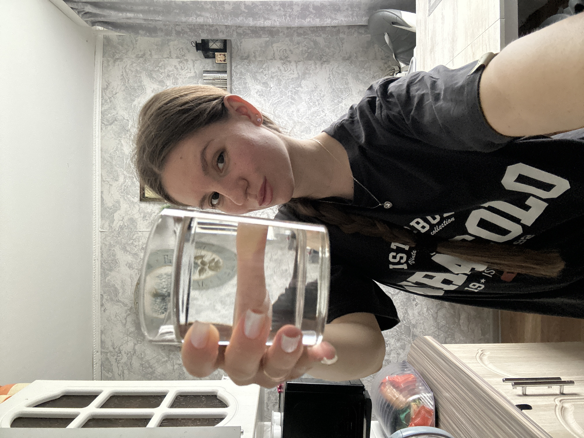 Woman enjoys morning breakfast routine in Klin kitchen