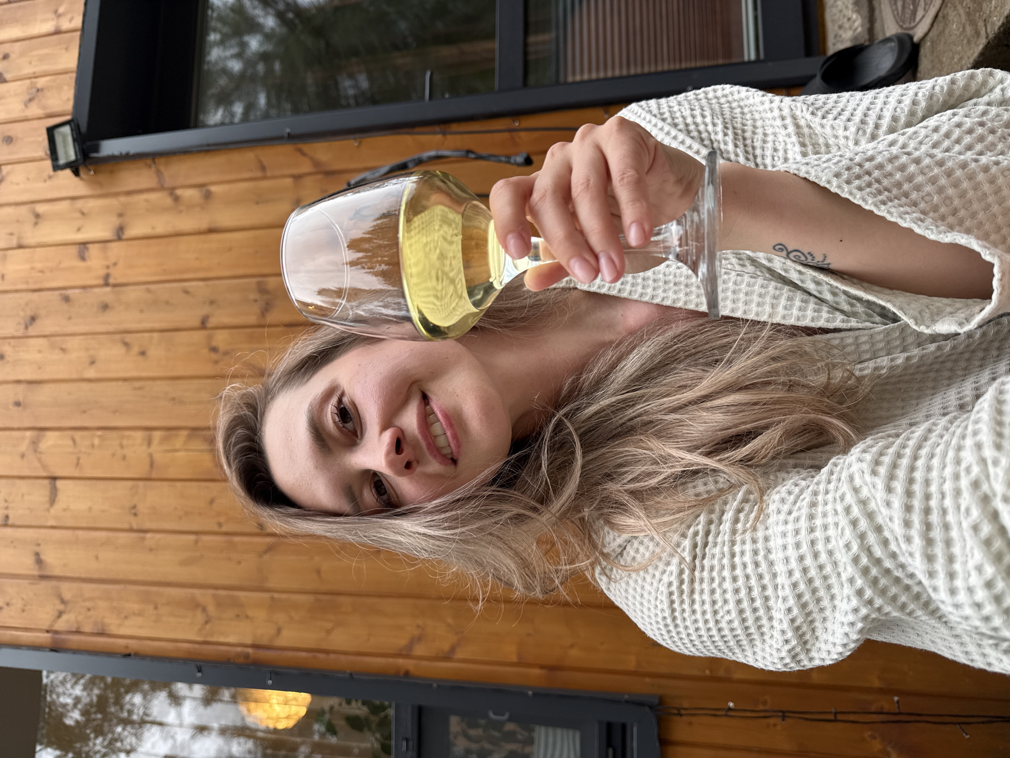 Woman enjoys leisurely afternoon at Russian forest cabin