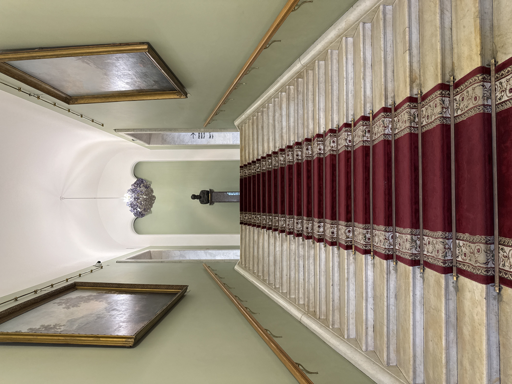 Visitor documents historic Moscow building interior and museum exhibits