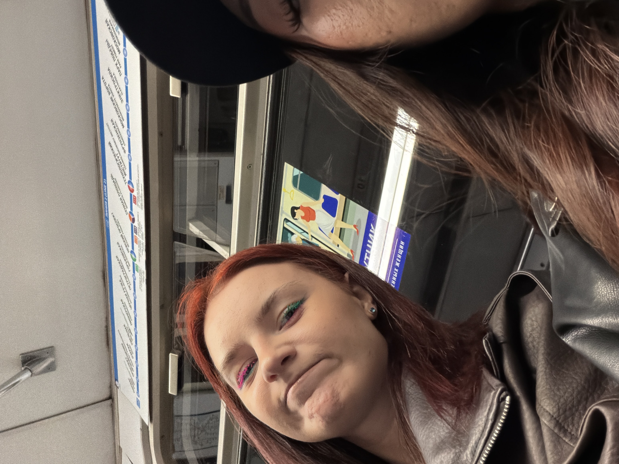 Young women photographed on subway during morning commute