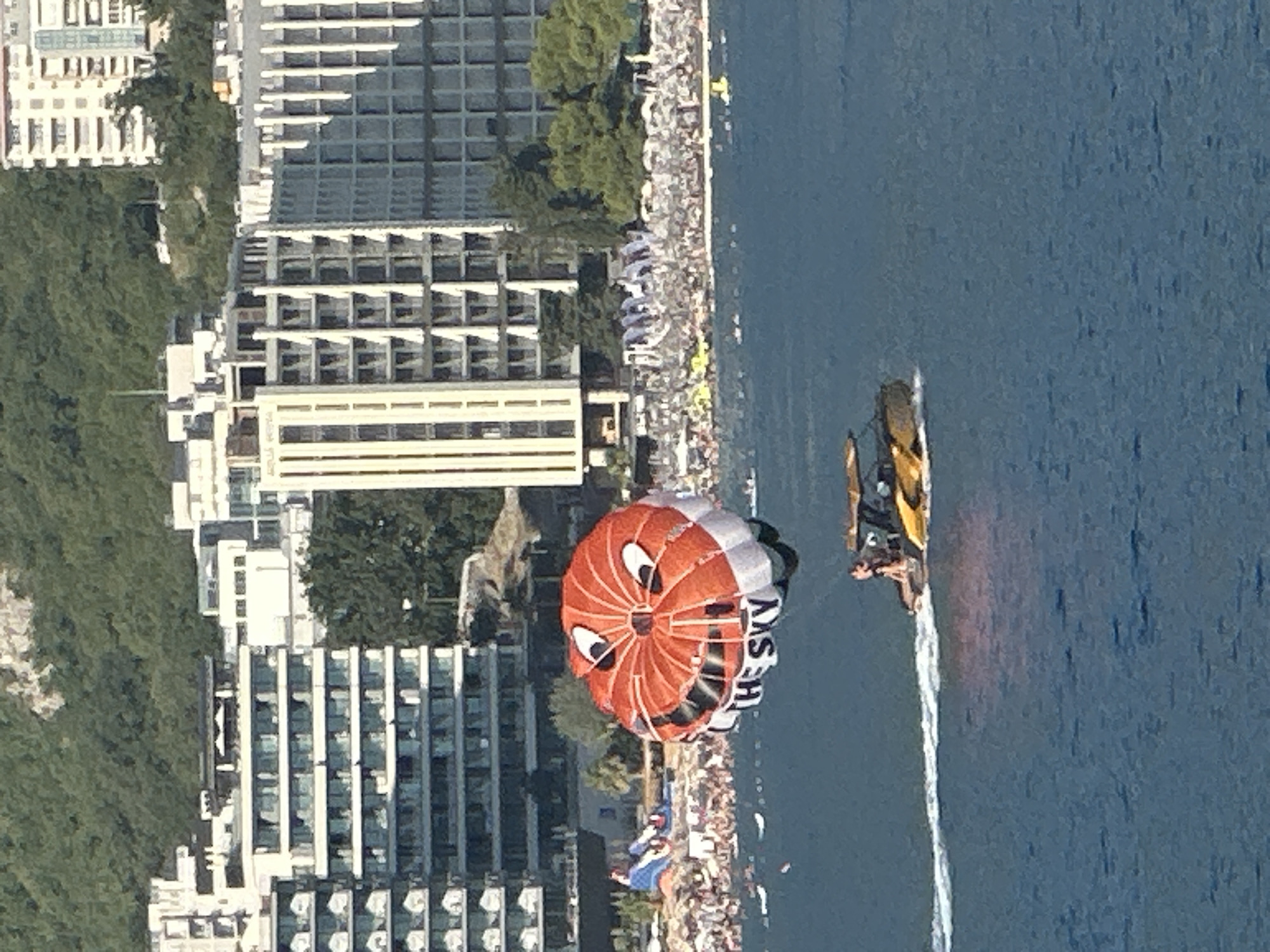 Cartoon-faced parasail flies over the Montenegrin coast