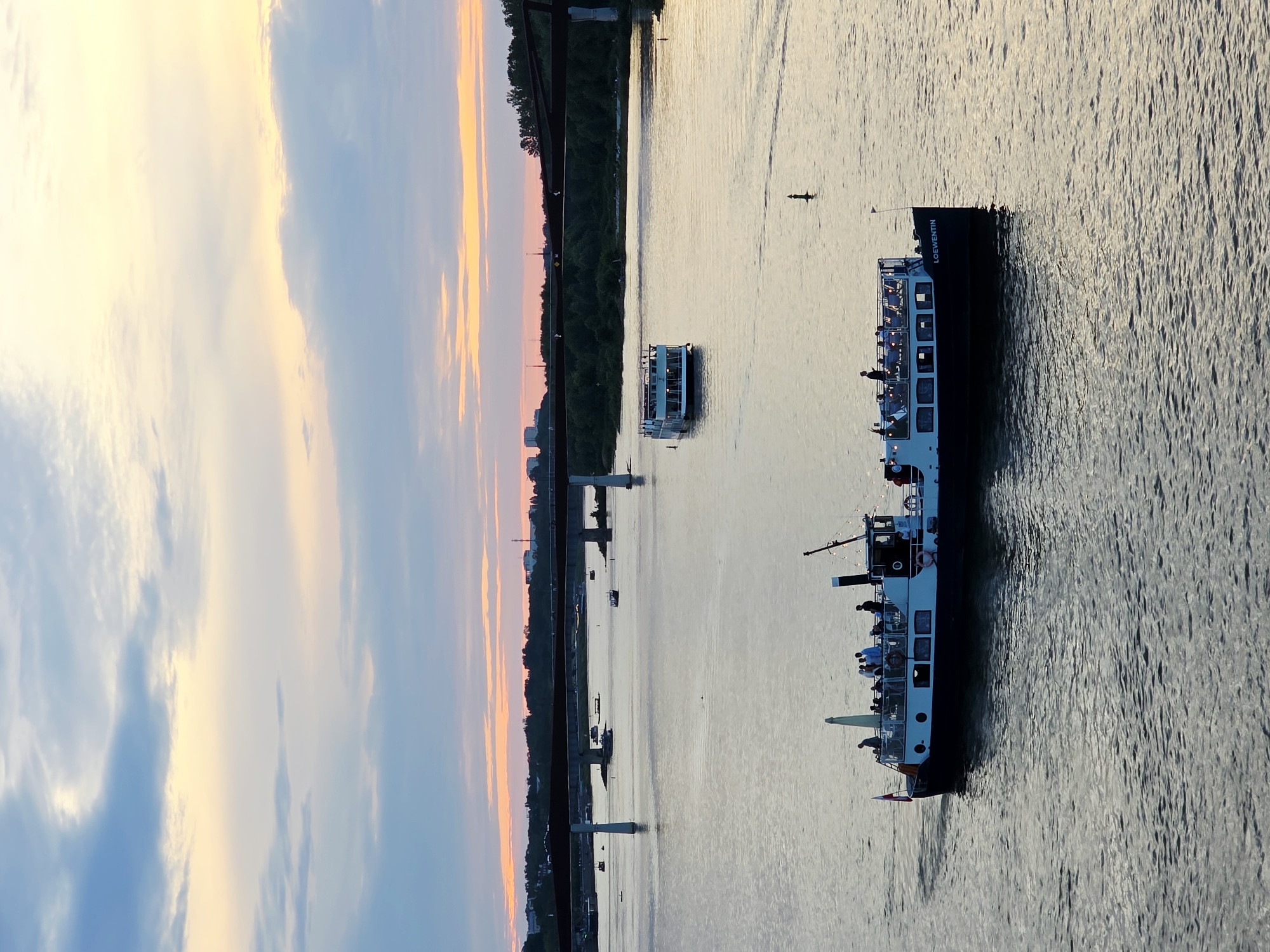 Warsaw's Vistula riverfront at golden hour, busy and alive