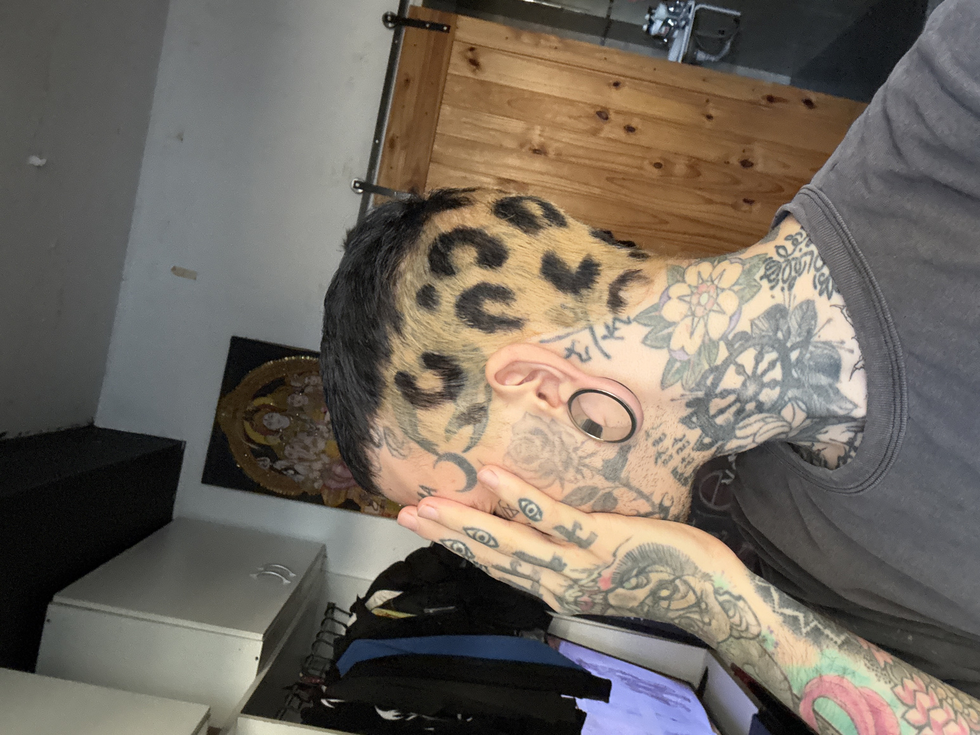 Tattooed person with leopard print hair observed in Buenos Aires