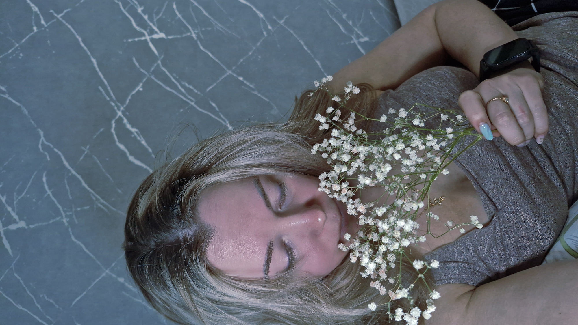 Woman photographed with baby's breath flowers in Otchor, Russia
