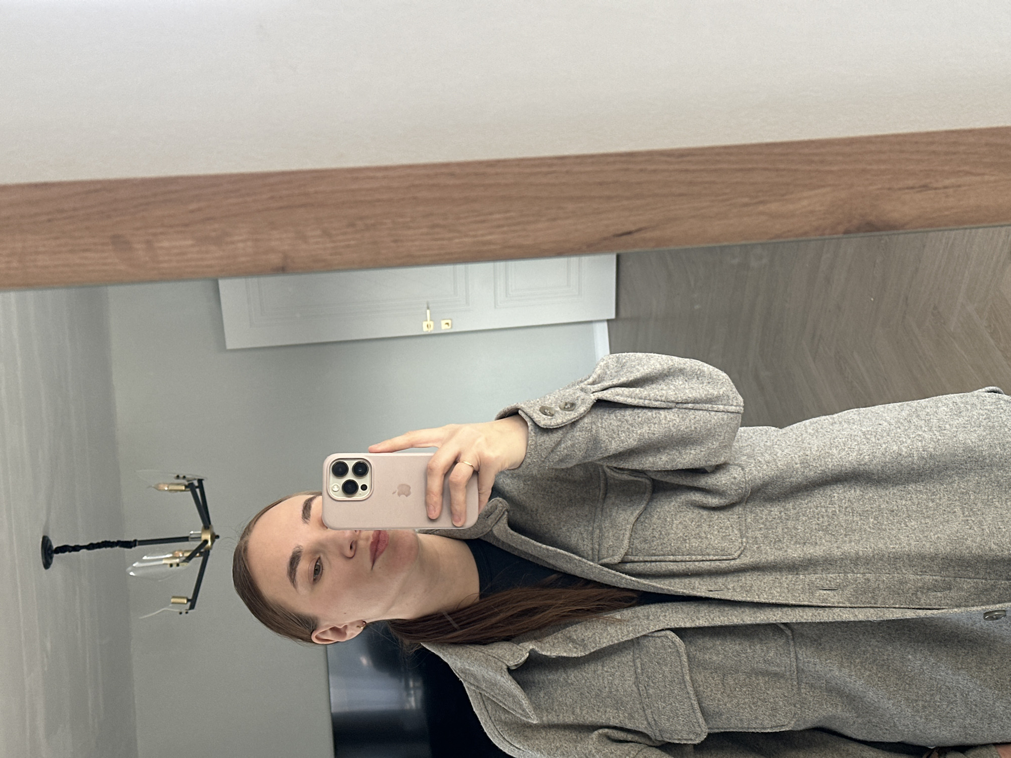 Woman takes mirror selfie in Kharnavy, Russia