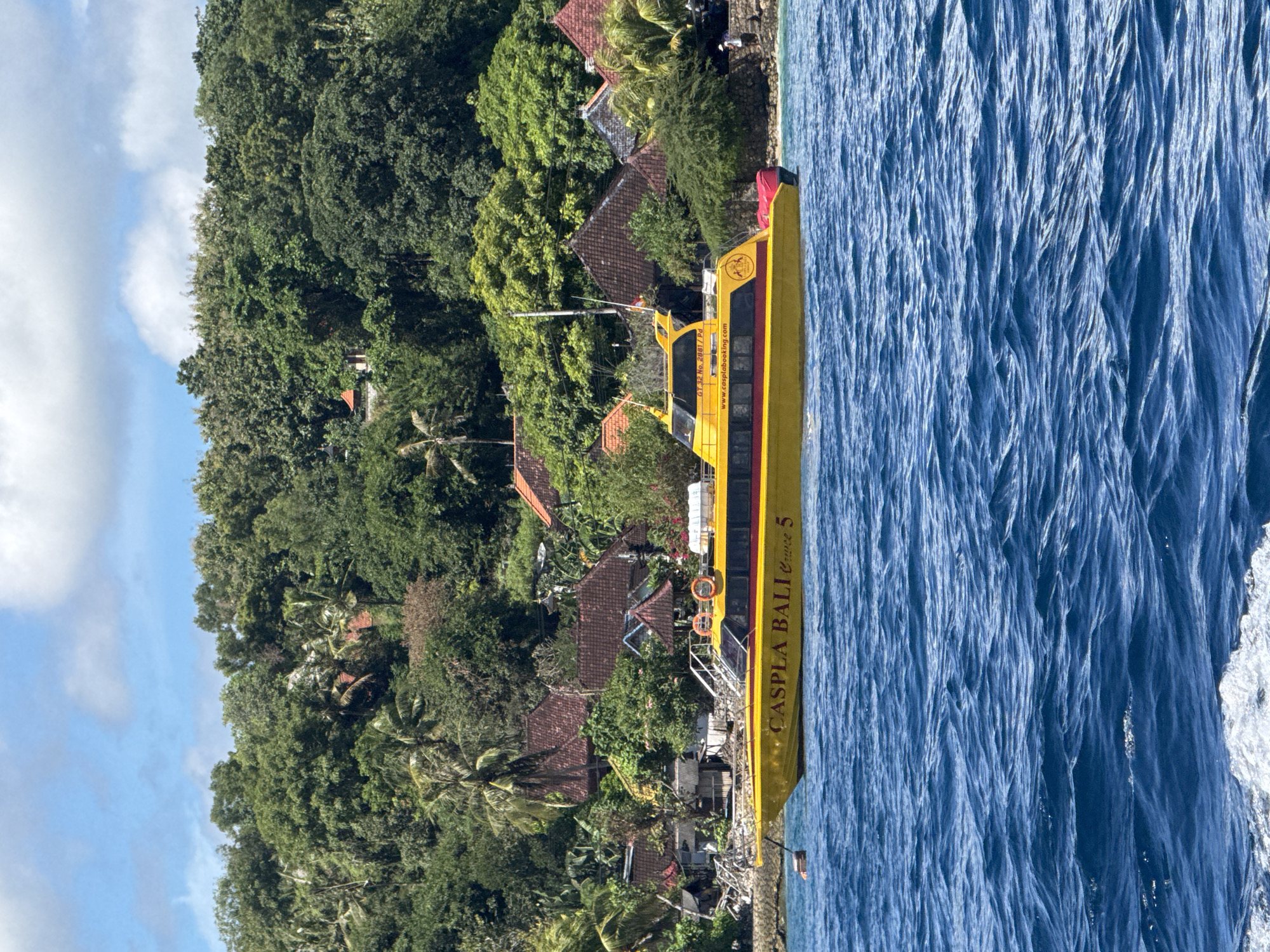 Boat tour captures scenic Nusa Penida coastline views