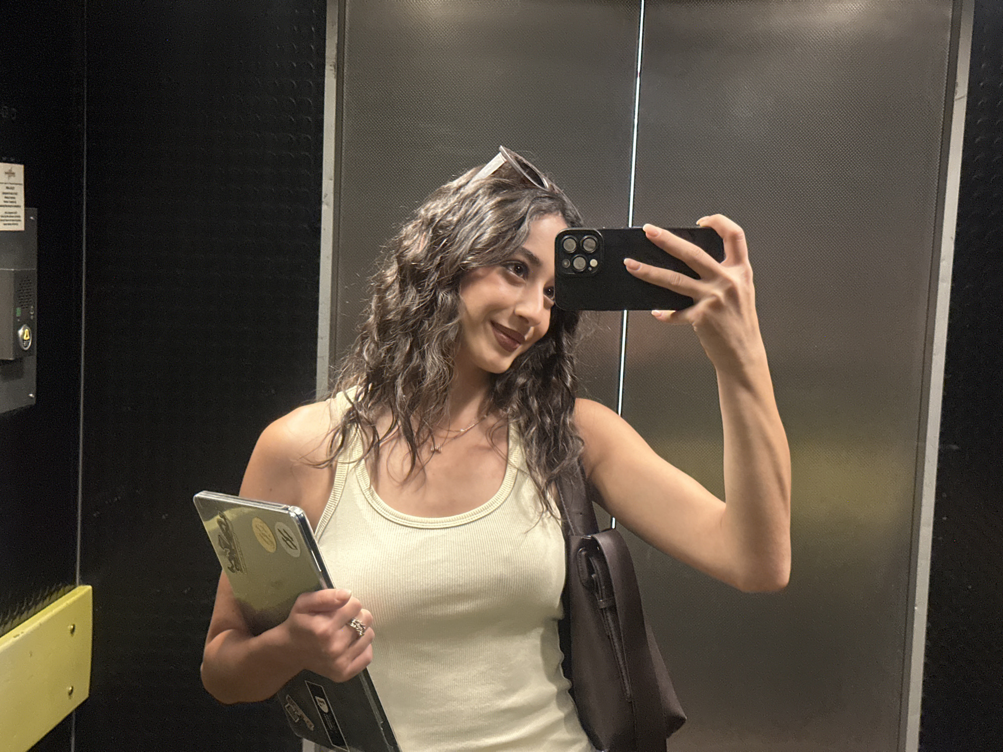 Woman Takes Selfies While Carrying Laptop in Milan