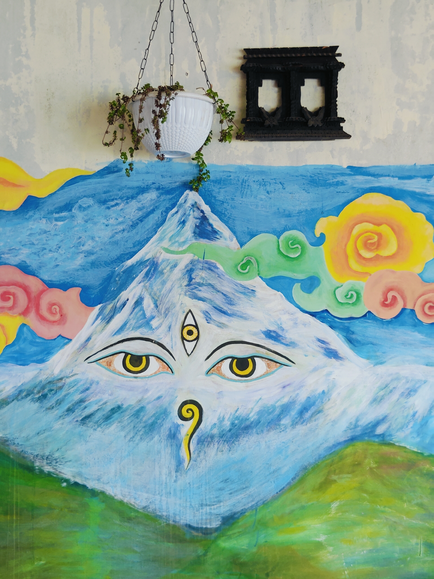 Overcast morning at Phewa Lake — paddleboards, cows, and lakeside murals