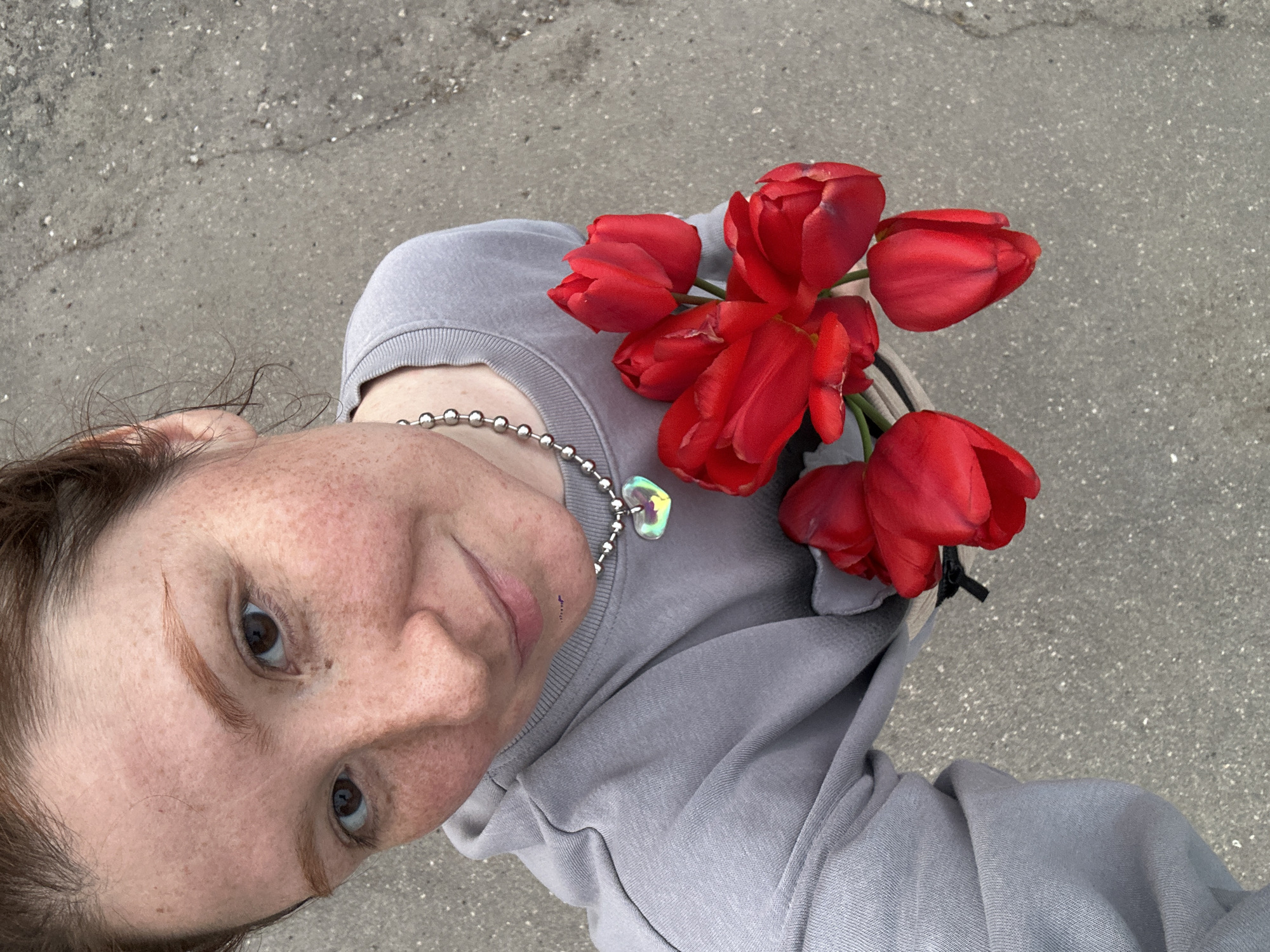 Person creates tulip memorial art with discarded windows in Russia
