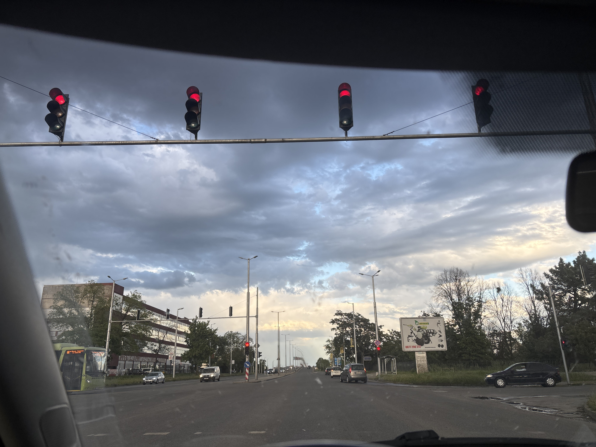 Traffic stops at red lights under cloudy skies in Plovdiv
