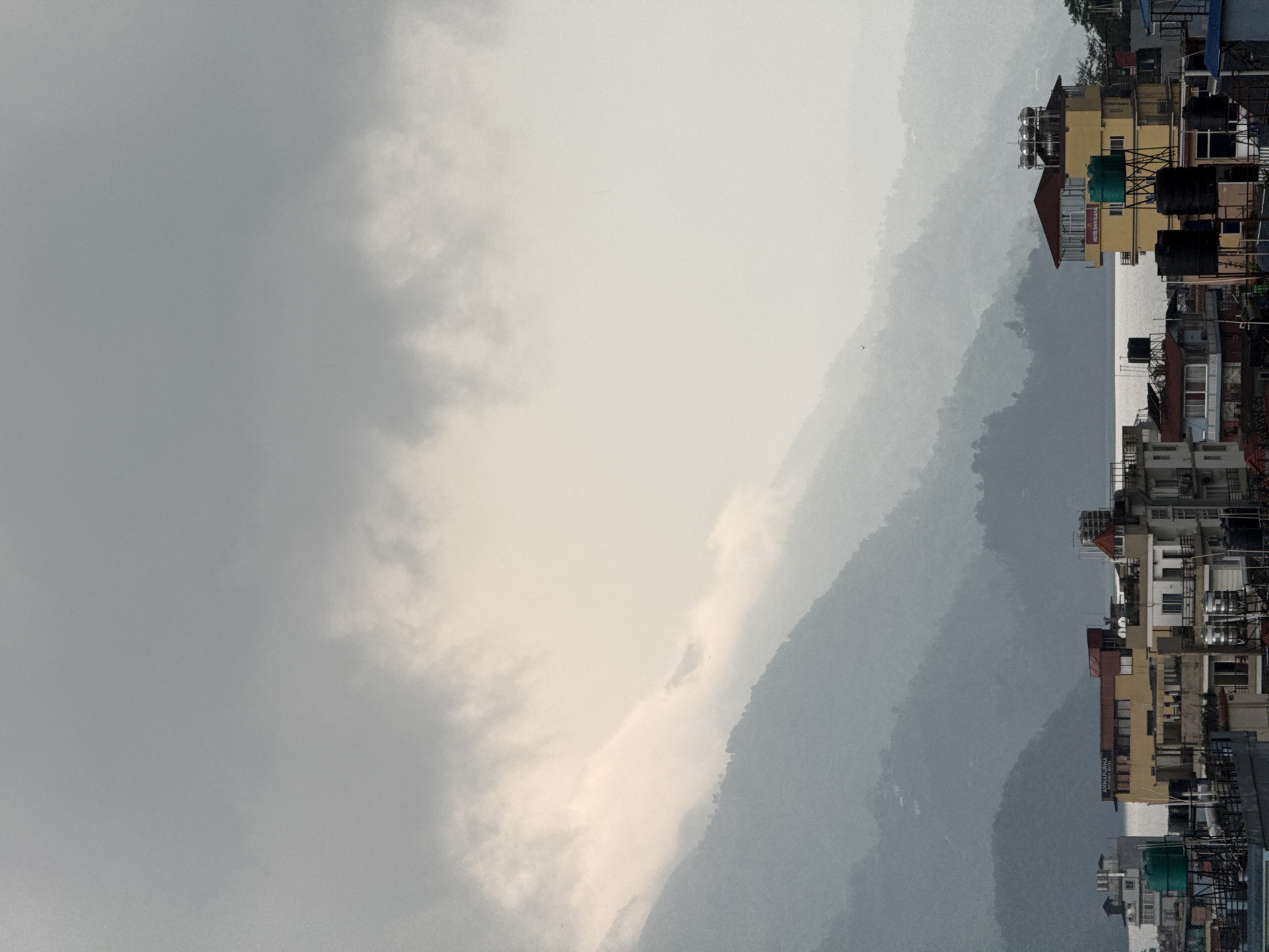 Cloudy morning shrouds Pokhara mountains in mist