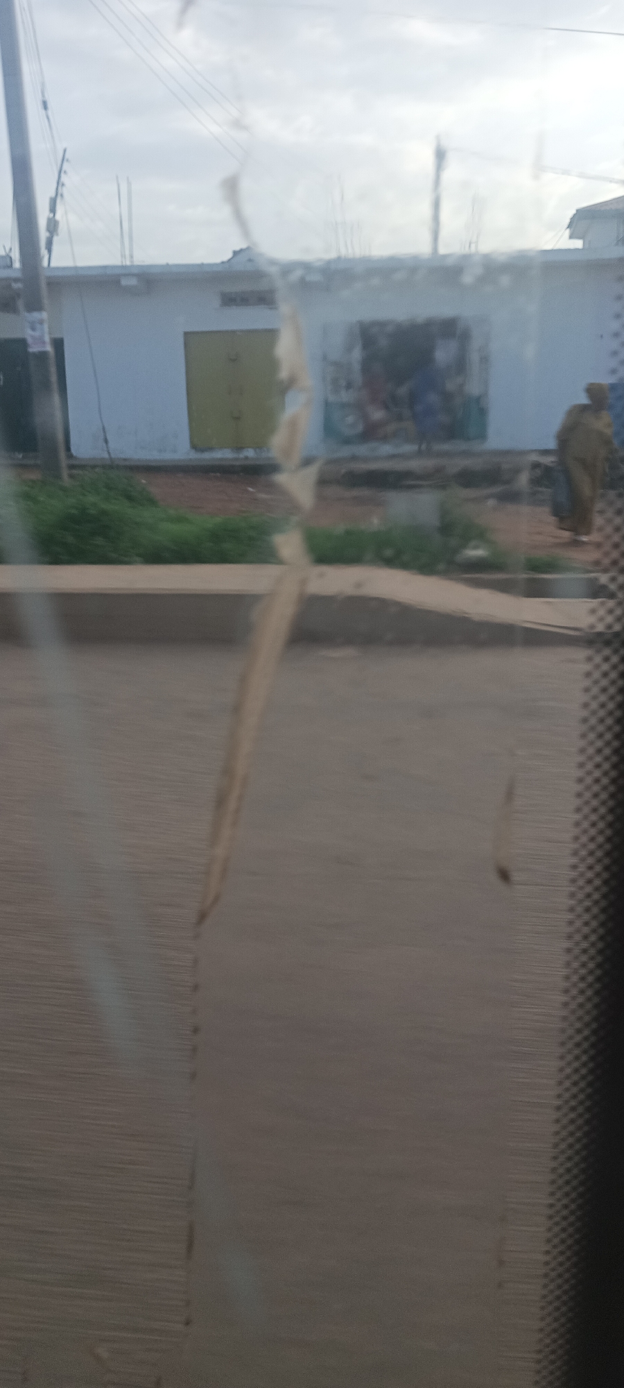Vehicle journey through Bukuru streets captures everyday Nigerian urban life