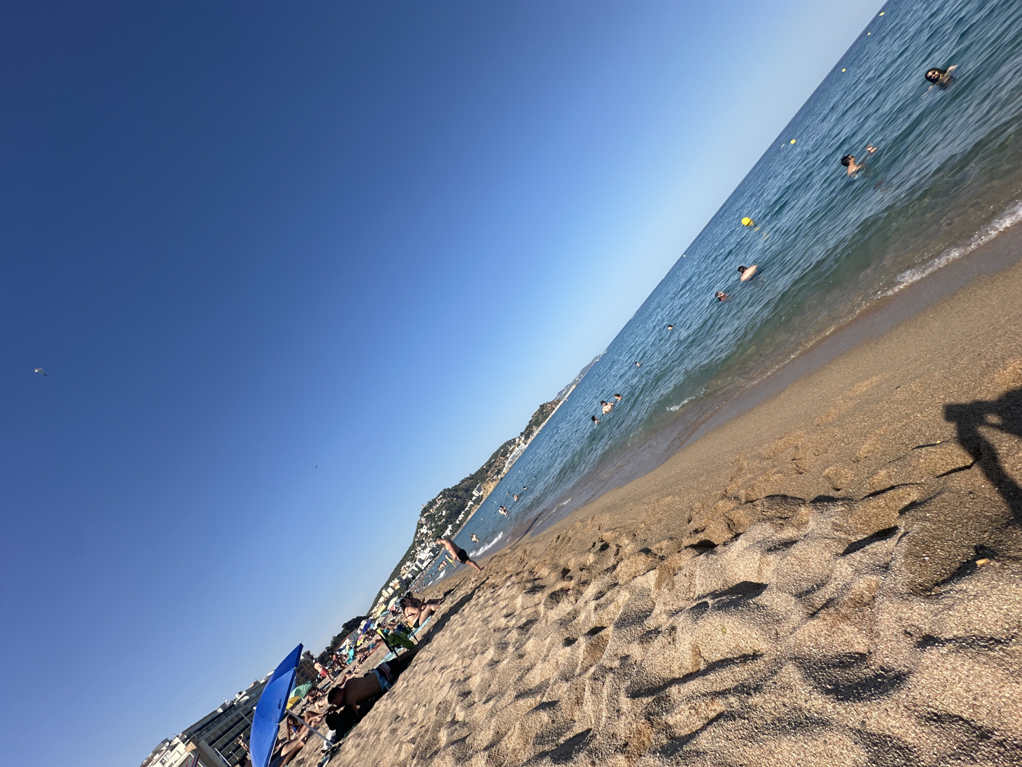 Busy summer afternoon on the beaches of Blanes, Spain