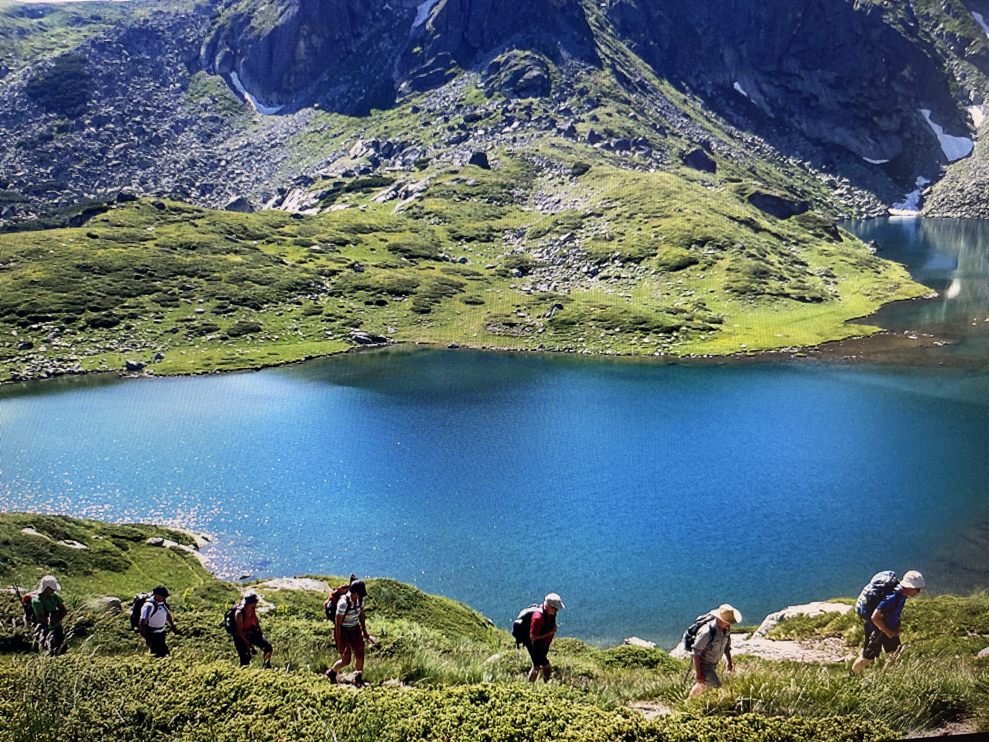 Seven hikers ascend Pirin Mountains trail in southwestern Bulgaria
